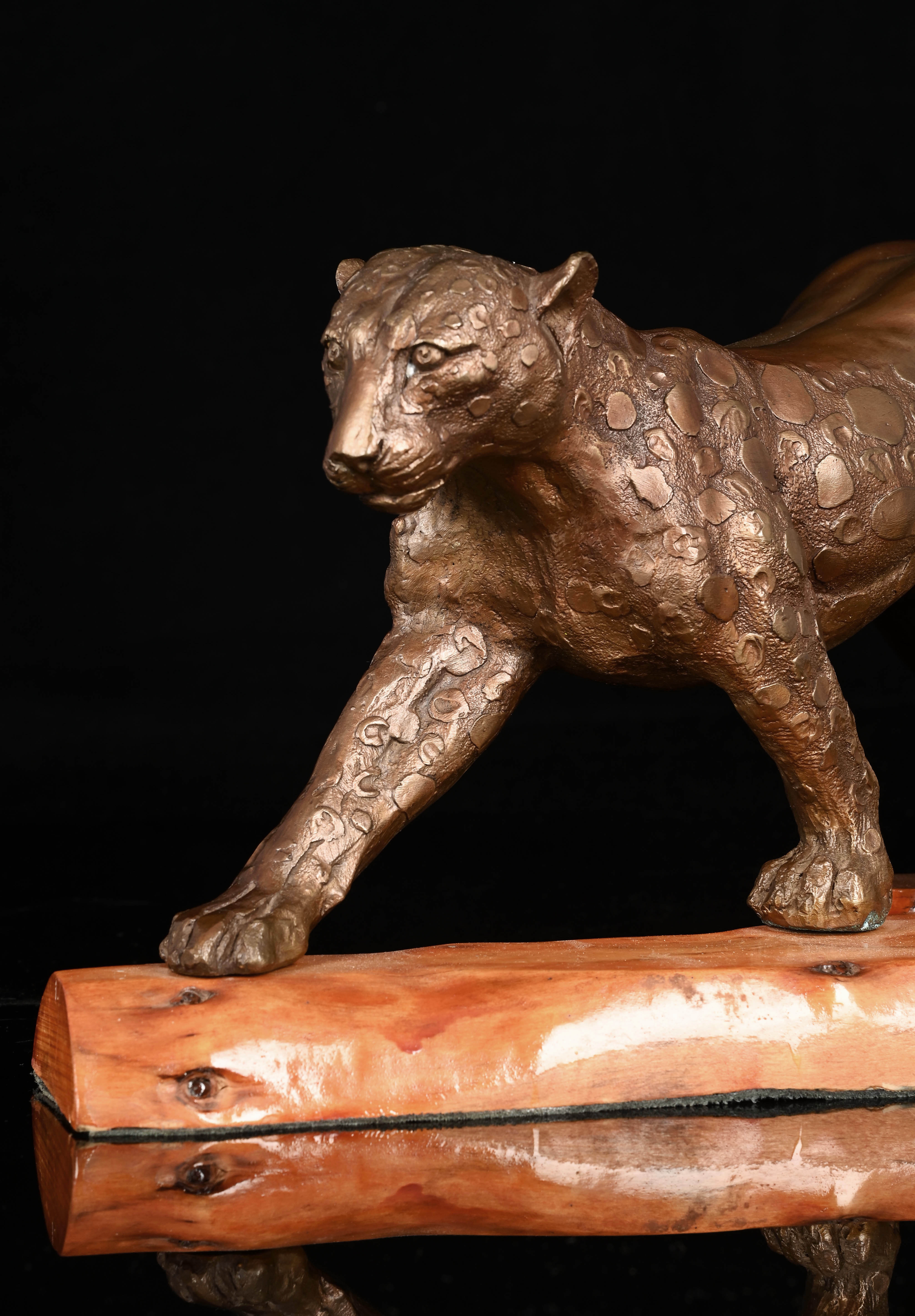 Artwork by Gile Brun, Anthropomorphic Woman Leopard, Made of bronze cast mounted on a wooden base