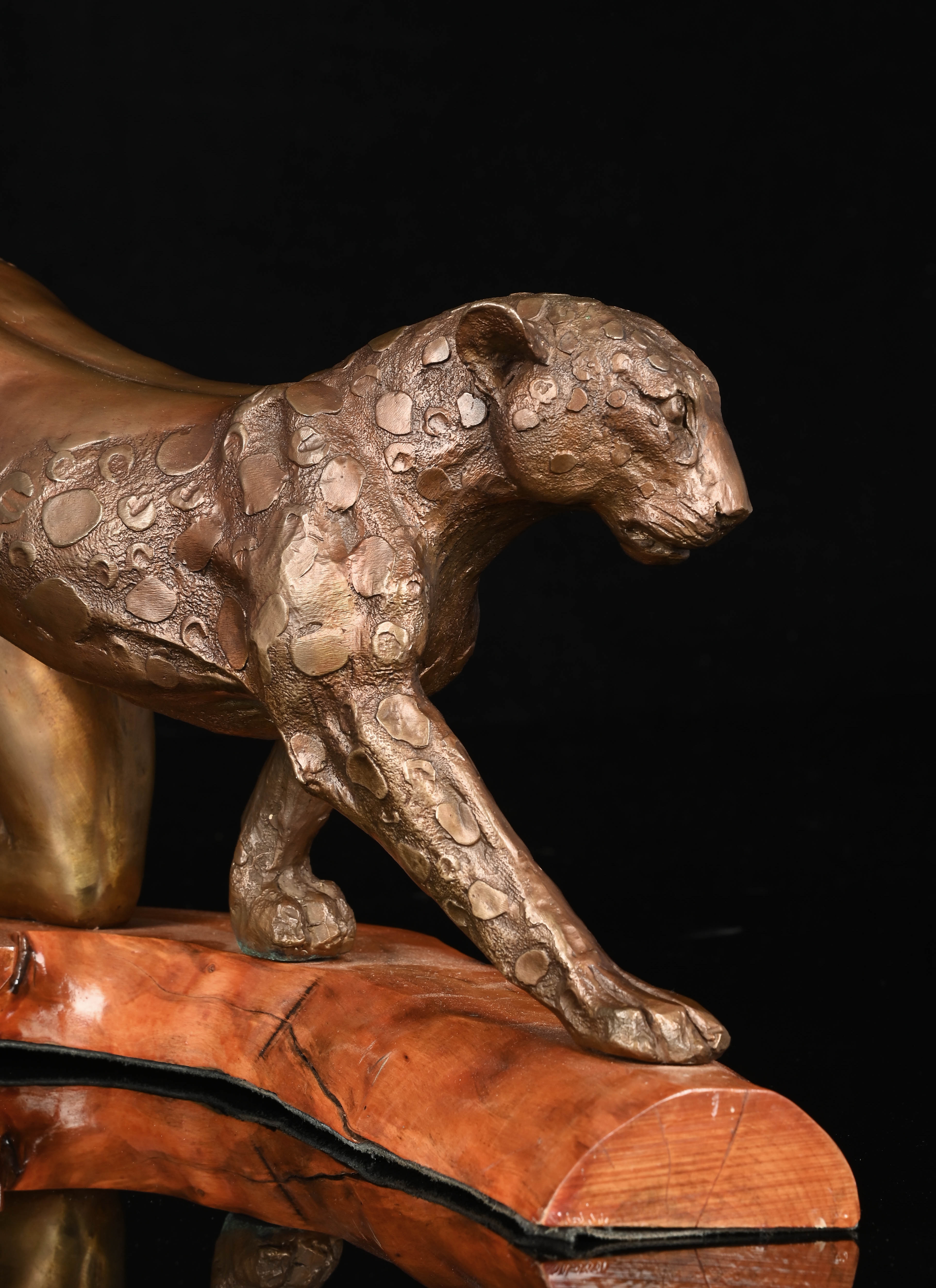 Artwork by Gile Brun, Anthropomorphic Woman Leopard, Made of bronze cast mounted on a wooden base