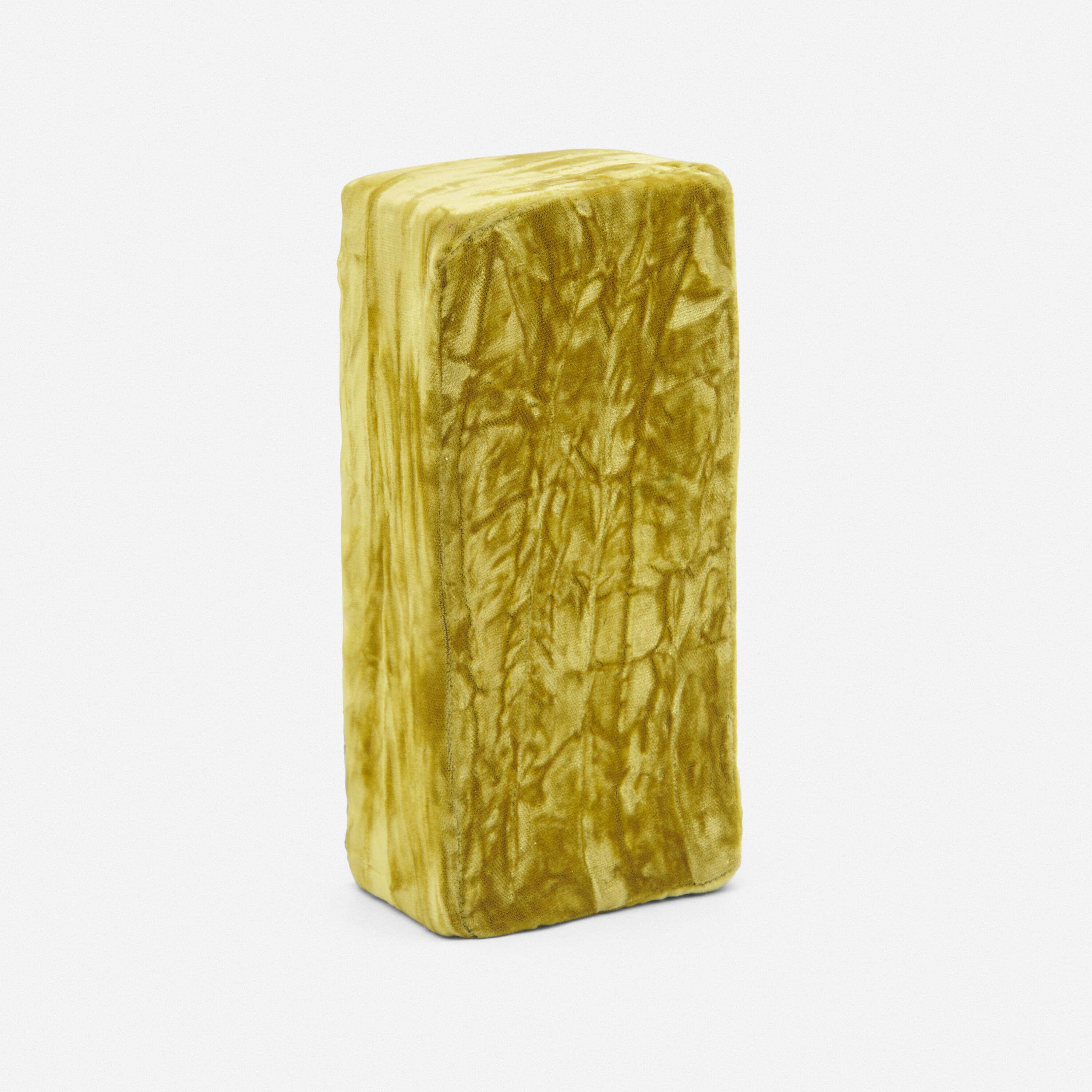 Artwork by Beverly Semmes, Gold Brick, Made of gold velvet over brick