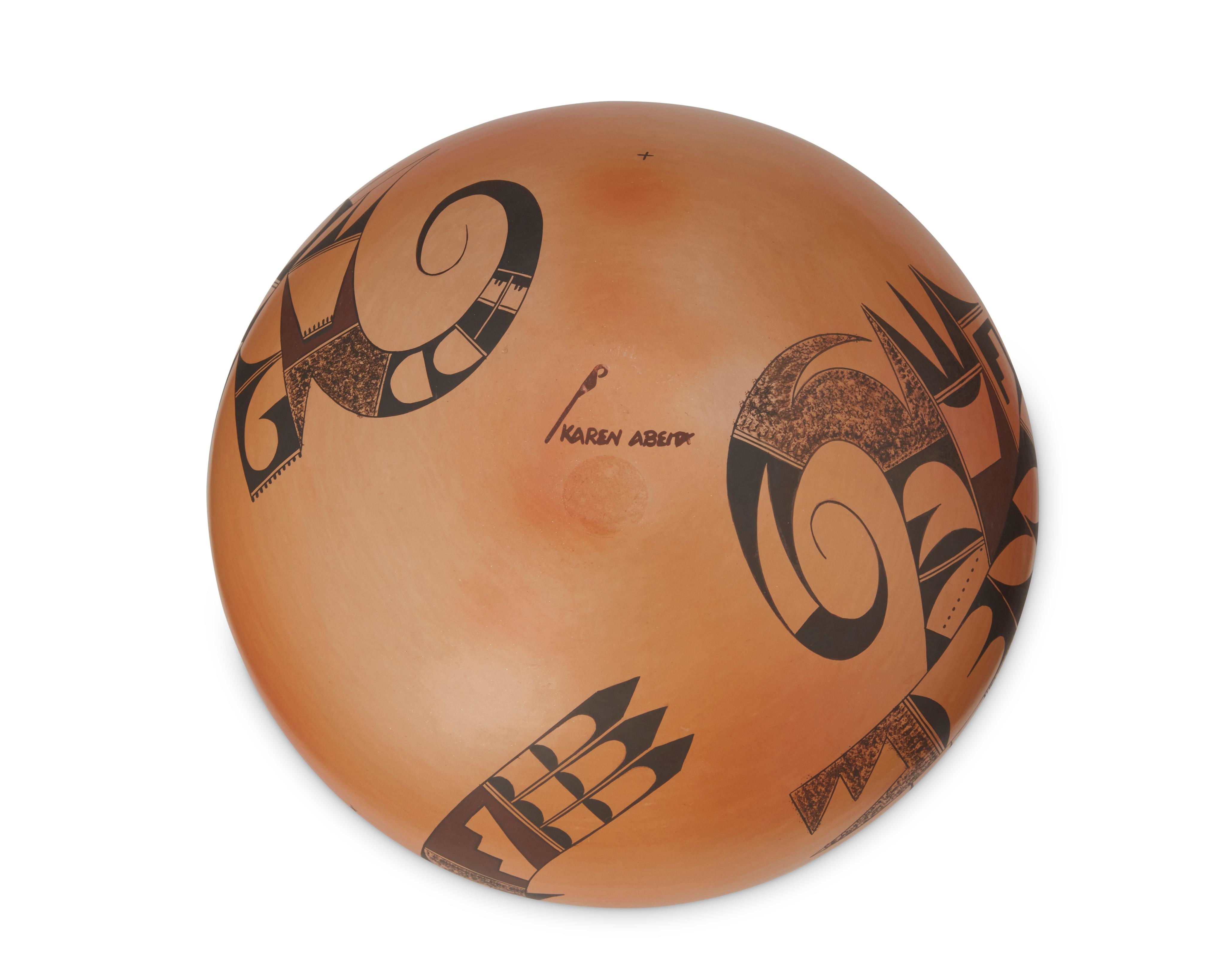 Artwork by Karen Abeita, A Hopi seed pot, Made of brown and black avian and geometric motifs on a terracotta wash ground