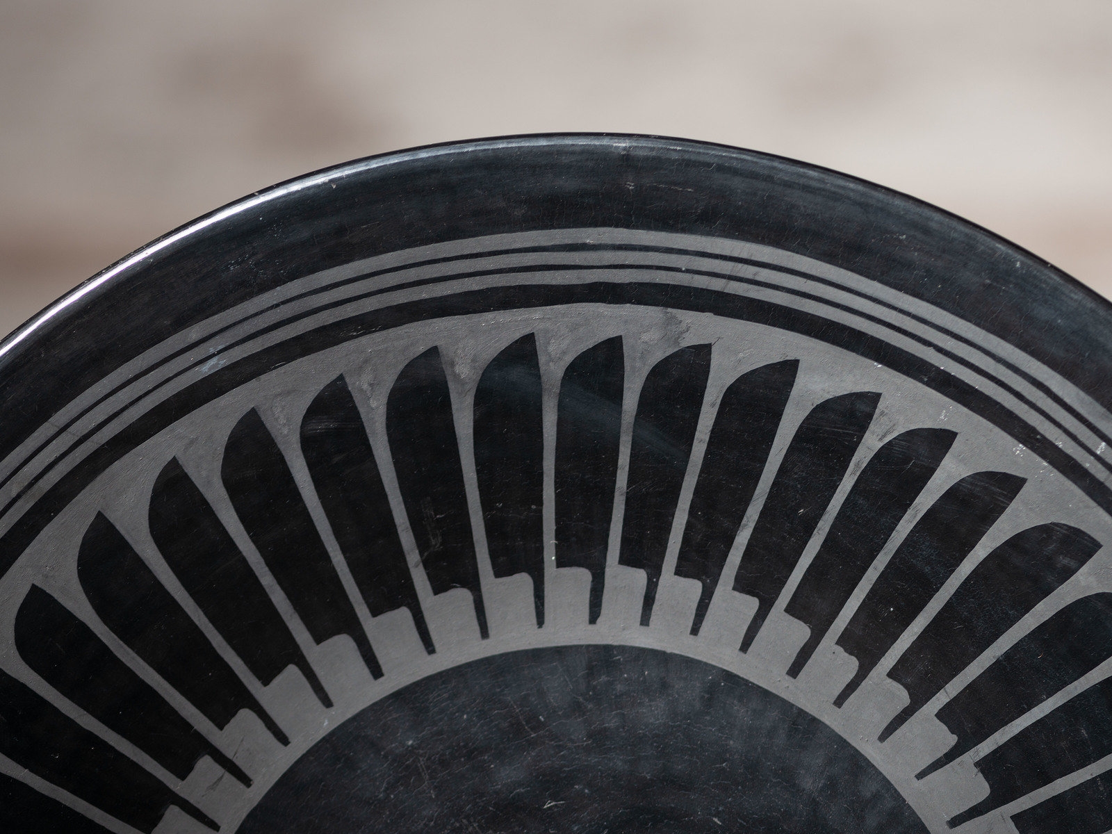 Artwork by Maria Montoya Martinez, Santana Roybal Martinez, Plate with Repeating Feathers, Made of Blackware Pottery