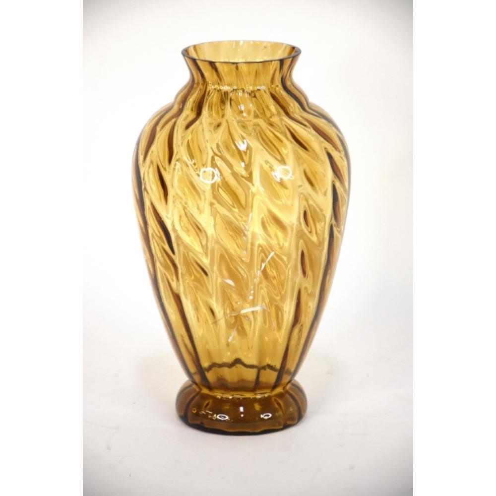 Artwork by Mary Gregory, A 19th Century Mary Gregory twist vase. Amber glass. 24.5cm tall., Made of Amber glass