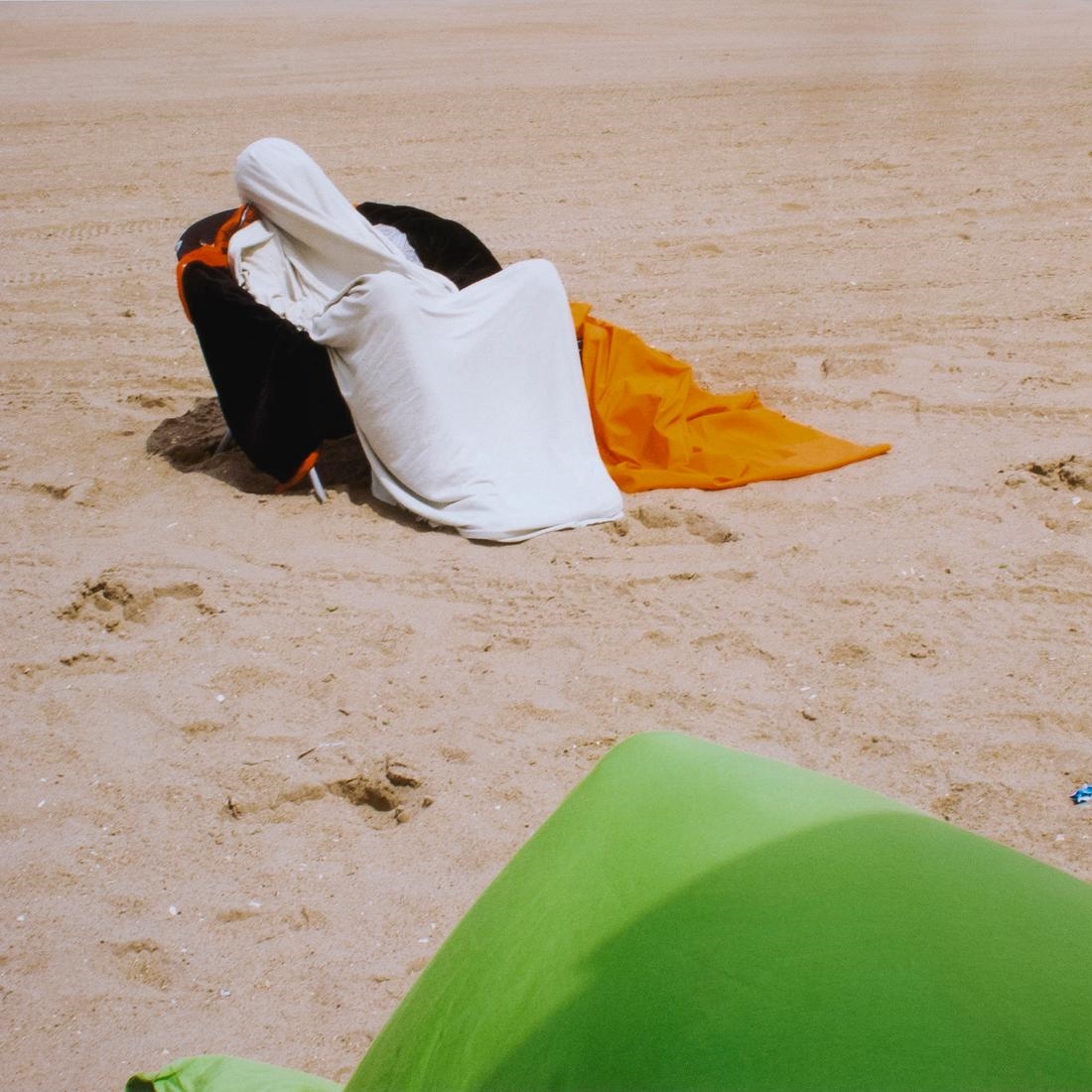 Artwork by Sylvia Plachy, Reclining Lifeguard Rockaway Beach, Made of archival pigment print