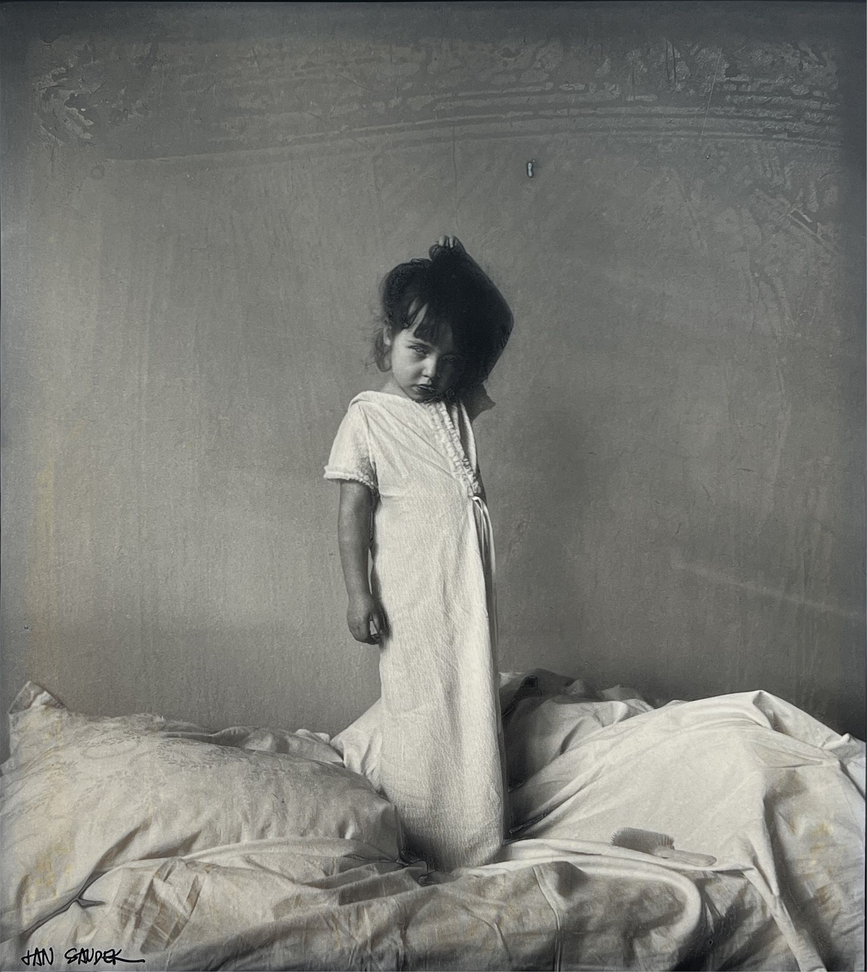 Child Standing on Bed by Jan Saudek