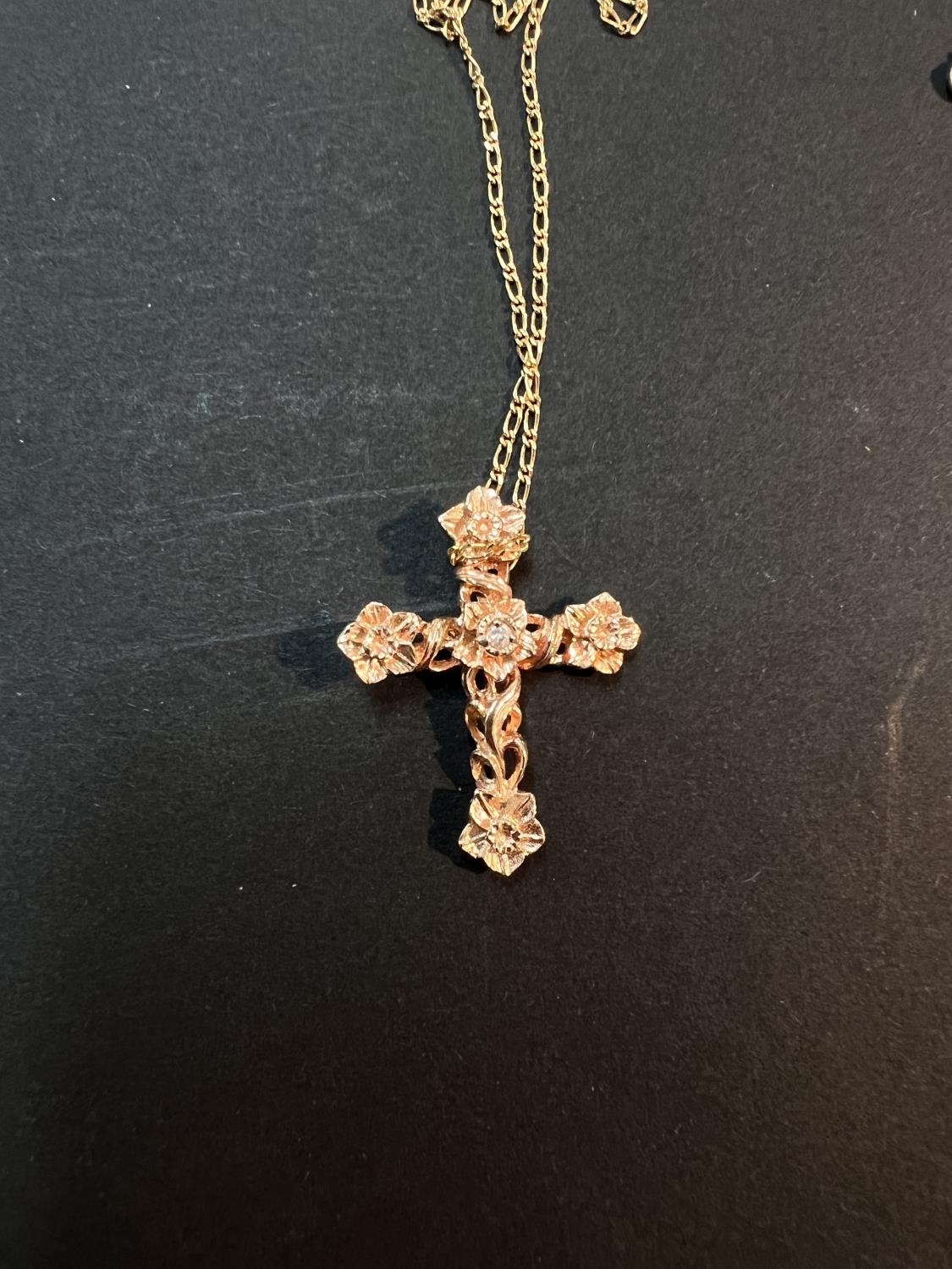 Stuart Devlin | A Stuart Devlin floral crucifix pendant in 14 carat ...