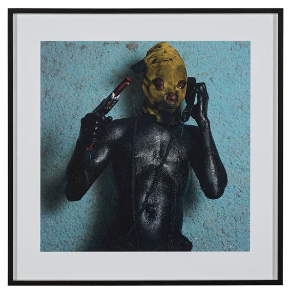 Man with Gun and Phone, Jacmel, Haiti, 2004 by Phyllis Galembo, 2004