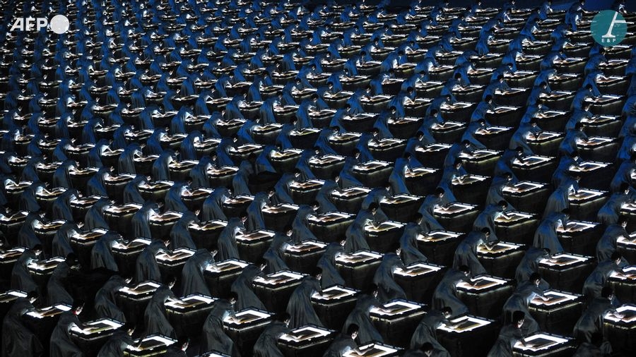 Percussionists banging their Fou drums at the start of the Olympic Games opening ceremony by Joe Klamar, 2008