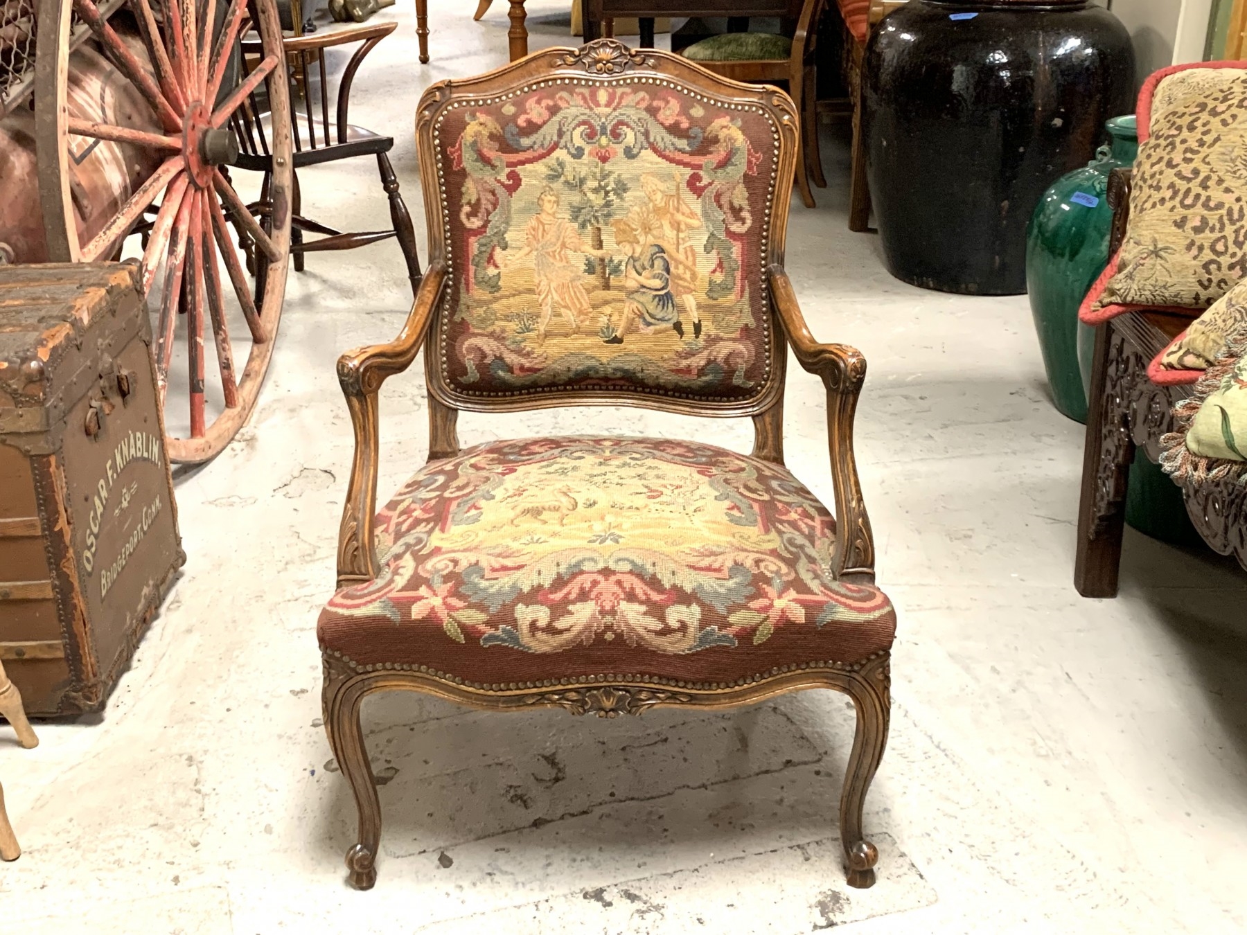 Louis XV style arm chair with needlepoint upholstery.
