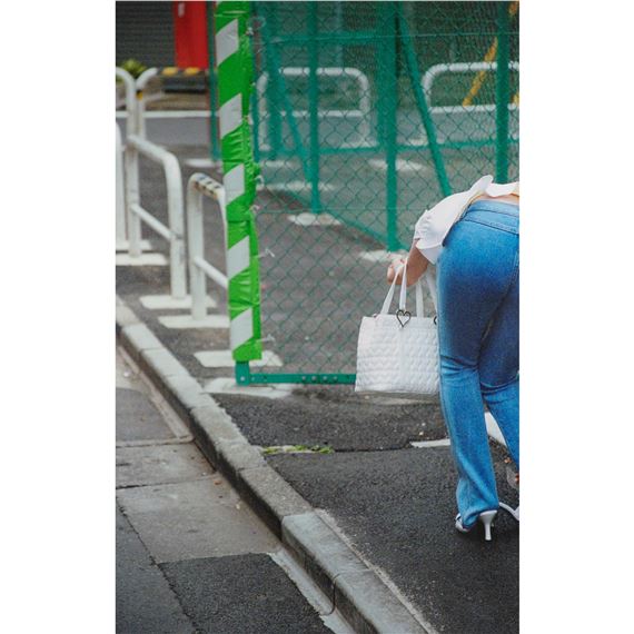 WOMAN ADJUSTING SHOE, 2004 by Stephen Waddell, 2004