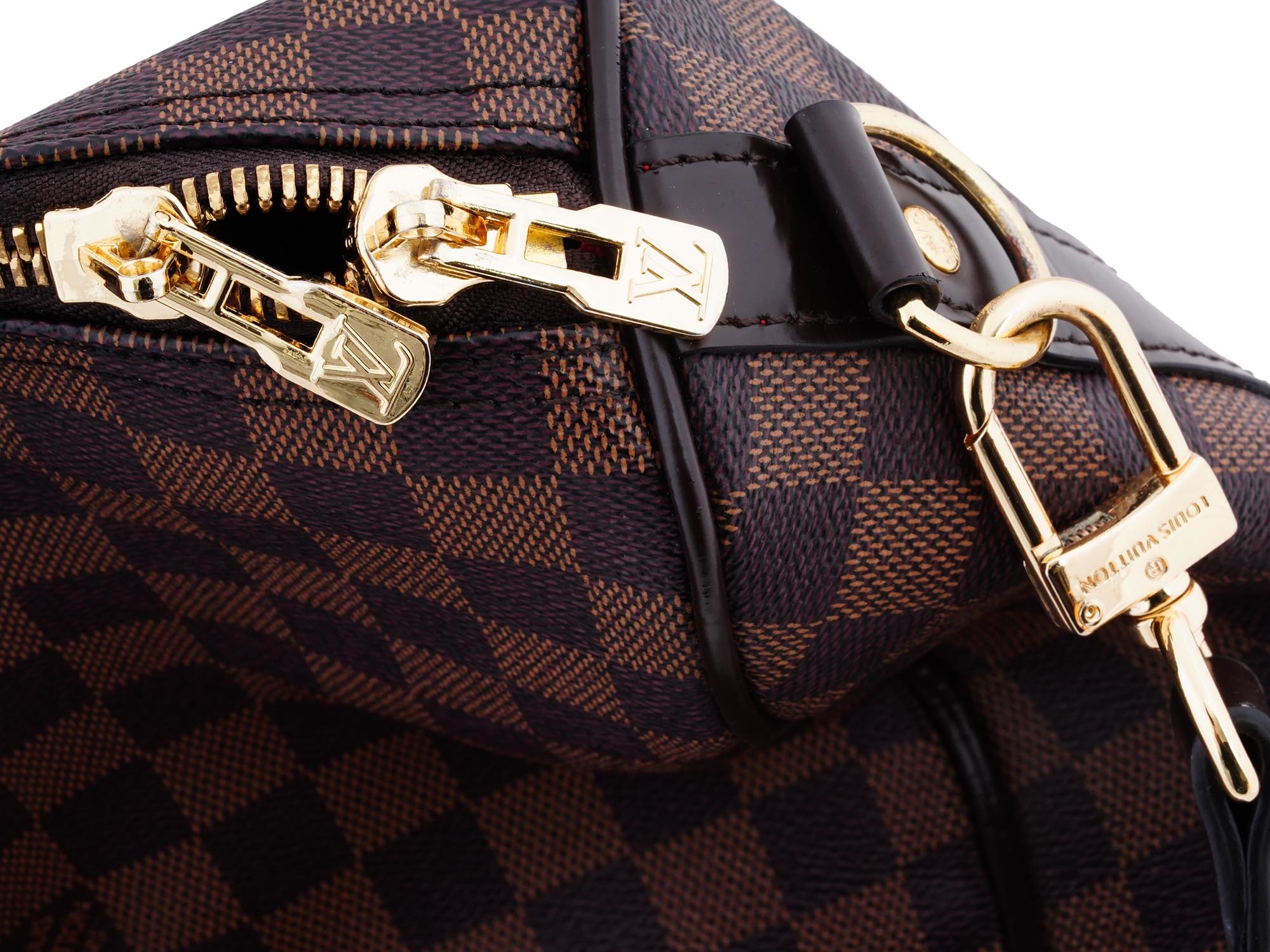 Louis Vuitton  A Louis Vuitton Damier Ebene Keepall Bandouliere 45 bag.  The duffel bag is crafted of damier checkered coated canvas with dark brown  leather accents. It features rolled leather top