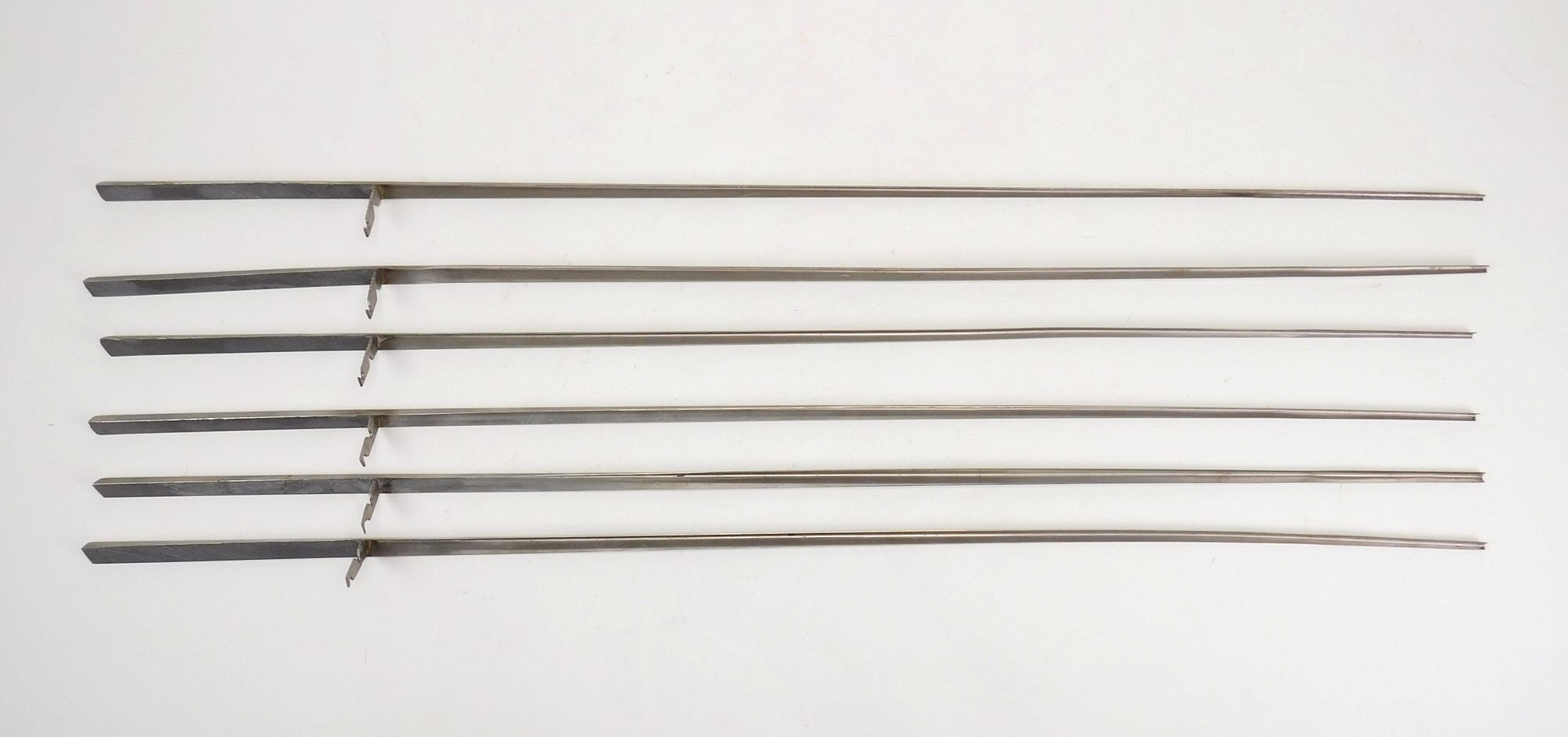 Artwork by George Rickey, Six Lines in an L, Made of stainless steel