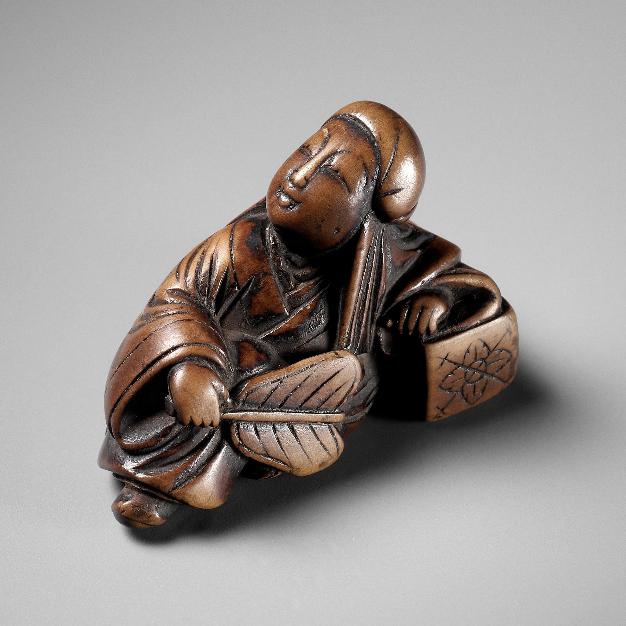 Enlightenment | AN EARLY WOOD NETSUKE DEPICTING ROSEI | MutualArt
