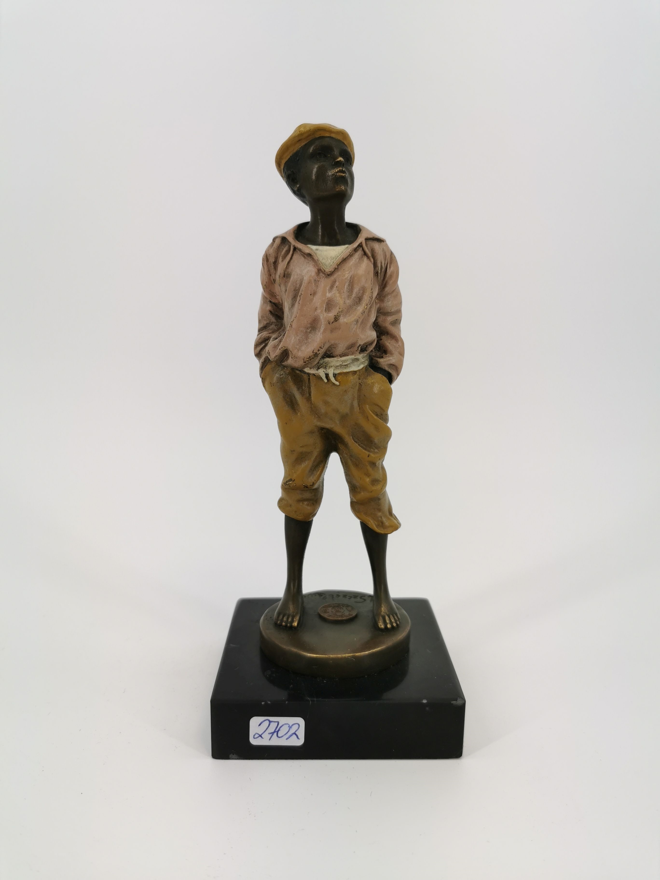 Artwork by Vaclav Szczeblwski, Pfeifender Knabe / Schiffsjunge, Made of bronze, light brown patina and accented with cold painting; marble pedestal