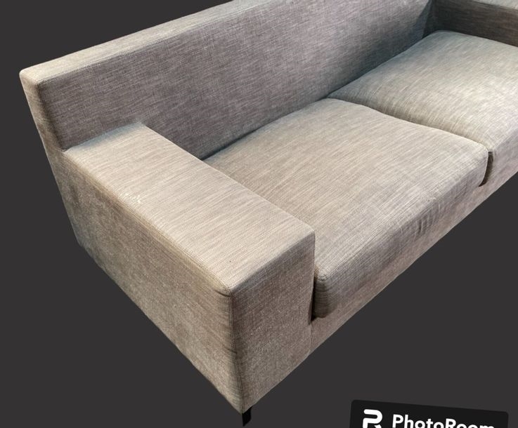 Artwork by Christian Liaigre, Two-seater sofa and comfortable armchair, Made of upholstered in gray fabric