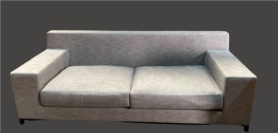 Two-seater sofa and comfortable armchair by Christian Liaigre