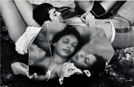 Mirror game on the beach, ca. by Burk Uzzle, circa 1975