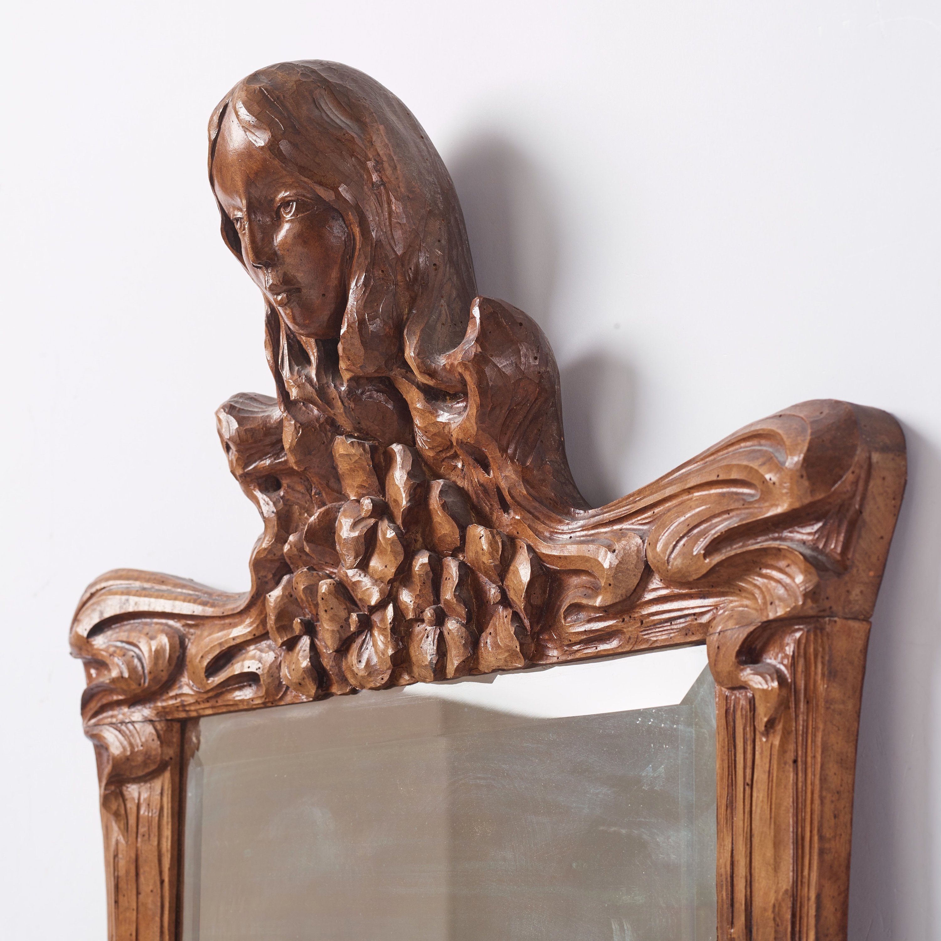 Artwork by Edvard Nilsson, an Art Nouveau sculptured mirror with table, Sweden , early 20thC., Made of mirror