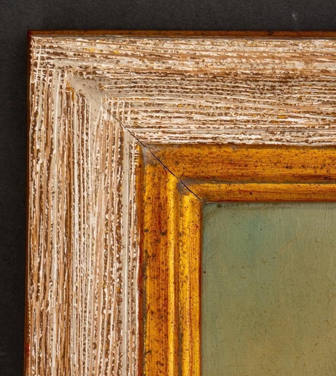 A pair of framed oil portraits depicting two figures in traditional attire.