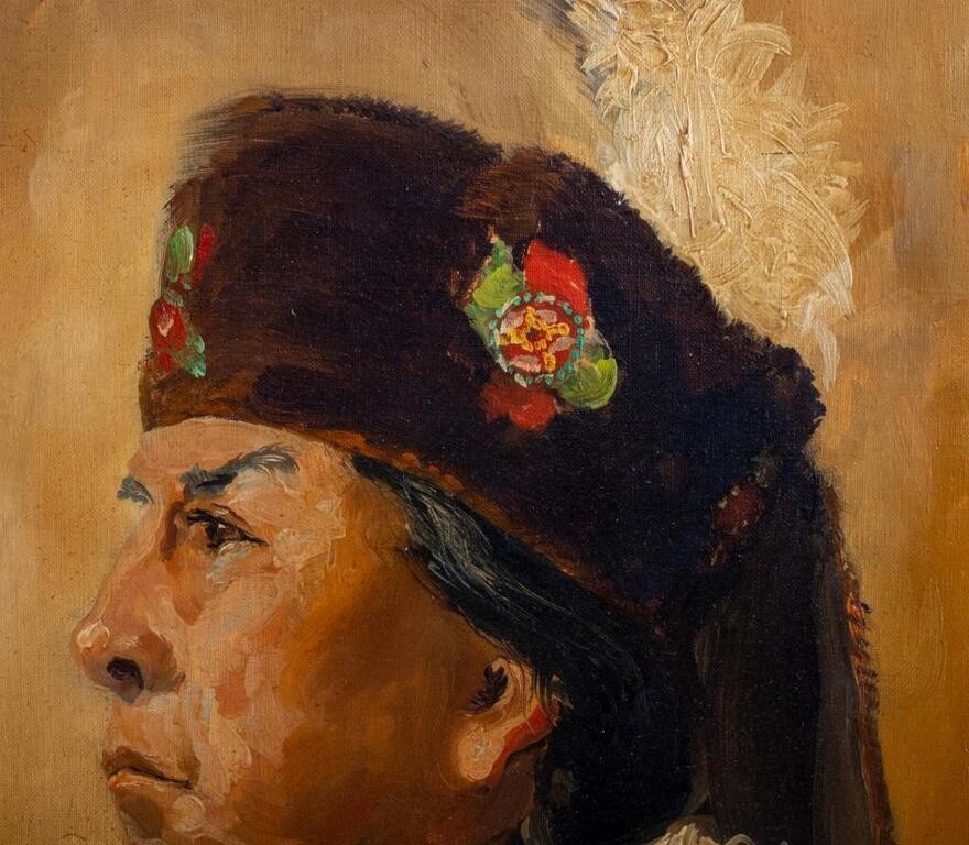 A pair of framed oil portraits depicting two figures in traditional attire.