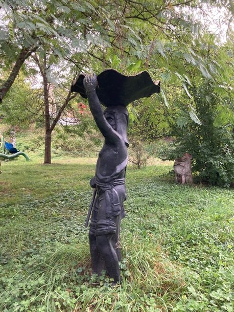 Modern School | Fisherman wearing a shell on his head Large sculpture ...