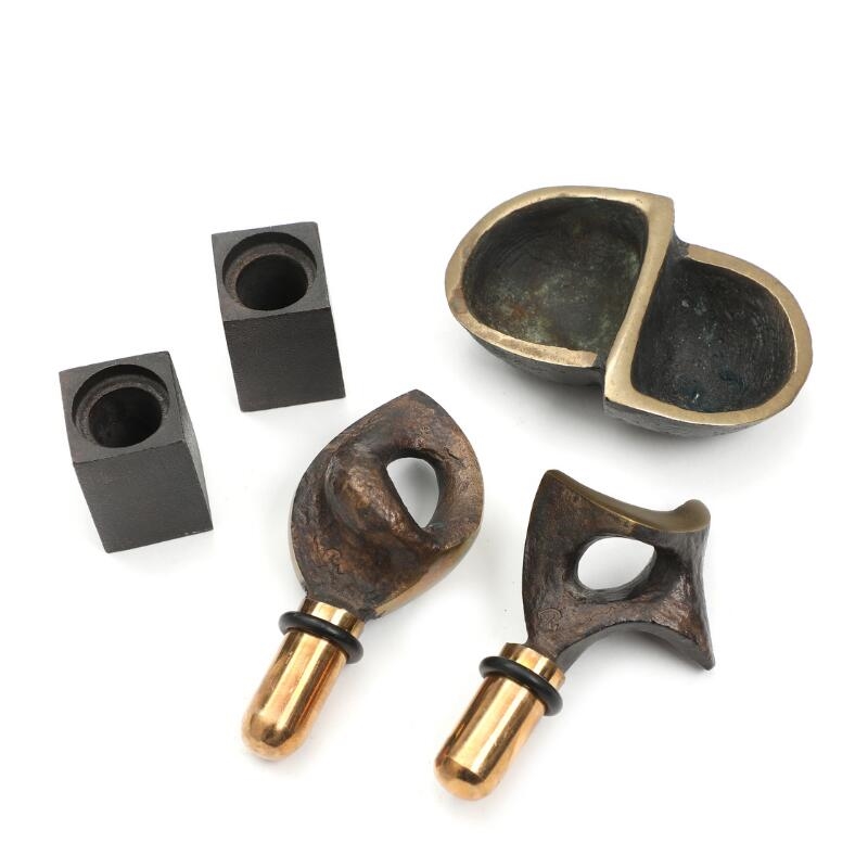Artwork by Peter Hesk Møller, Two partly polished and patinated bronze wine stoppers on stands and a bronze double bowl, Made of polished and patinated bronze