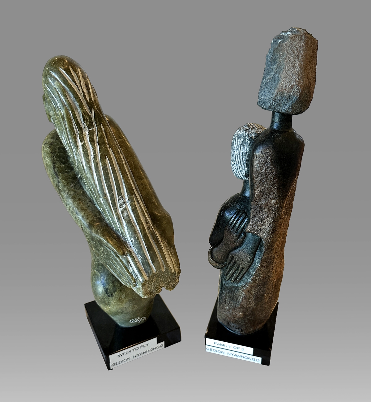 Artwork by Gedion Nyanhongo, NYANHONGO, Gedion, (Zimbabwean, b. 1967): 1) ''Family of Three'', 13.5'' in height, 14.75'' with the marble plinth and applied lazy susan, signed; 2) ''Wish to Fly'', 13.5'' with marble plinth, artist monogram., Made of marble plinth and applied