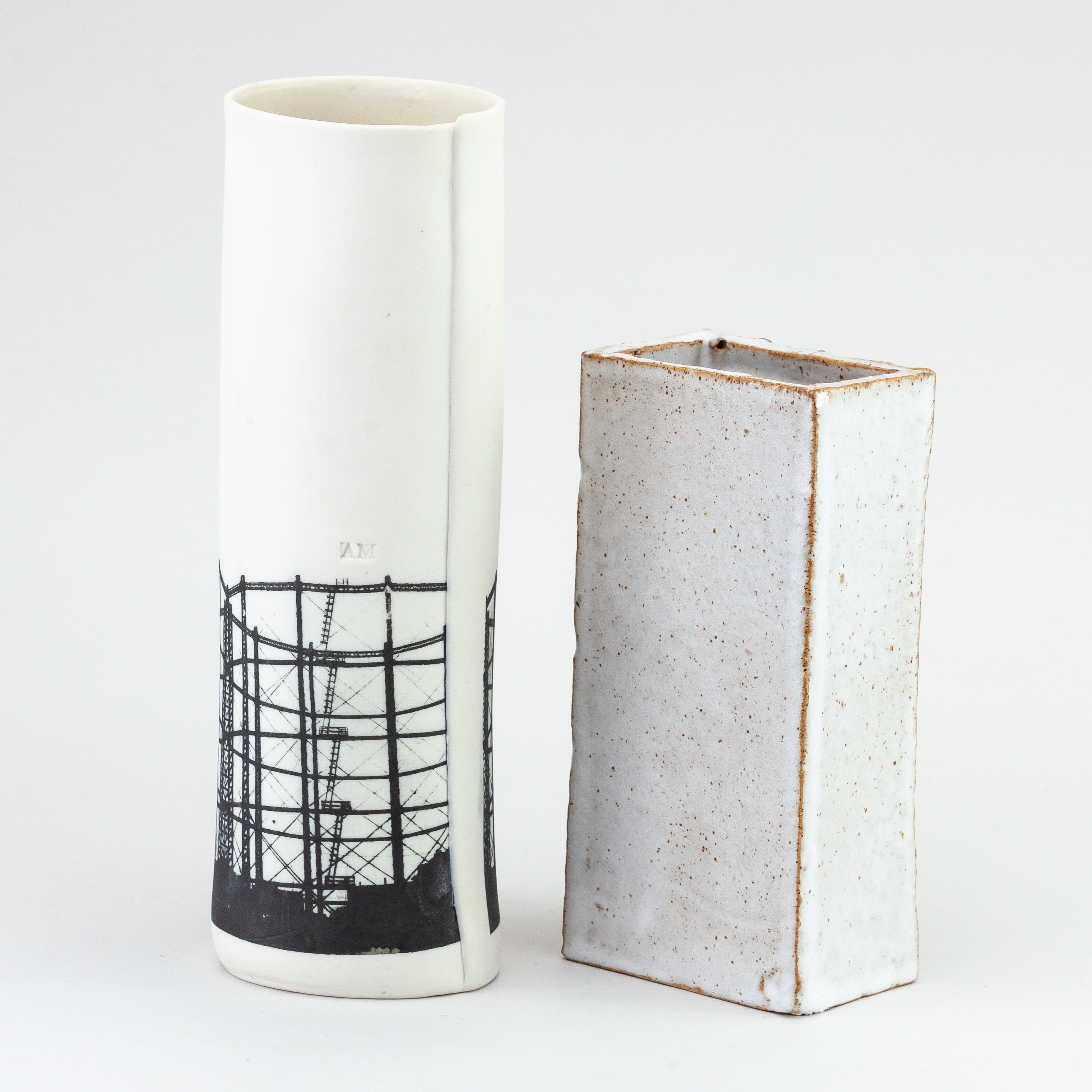 Artwork by Christian Marsden, a stoneware vase in the form of a London brick covered in mottled white glaze decorated with a printed photographic image of a gasholder, Made of mottled white glaze