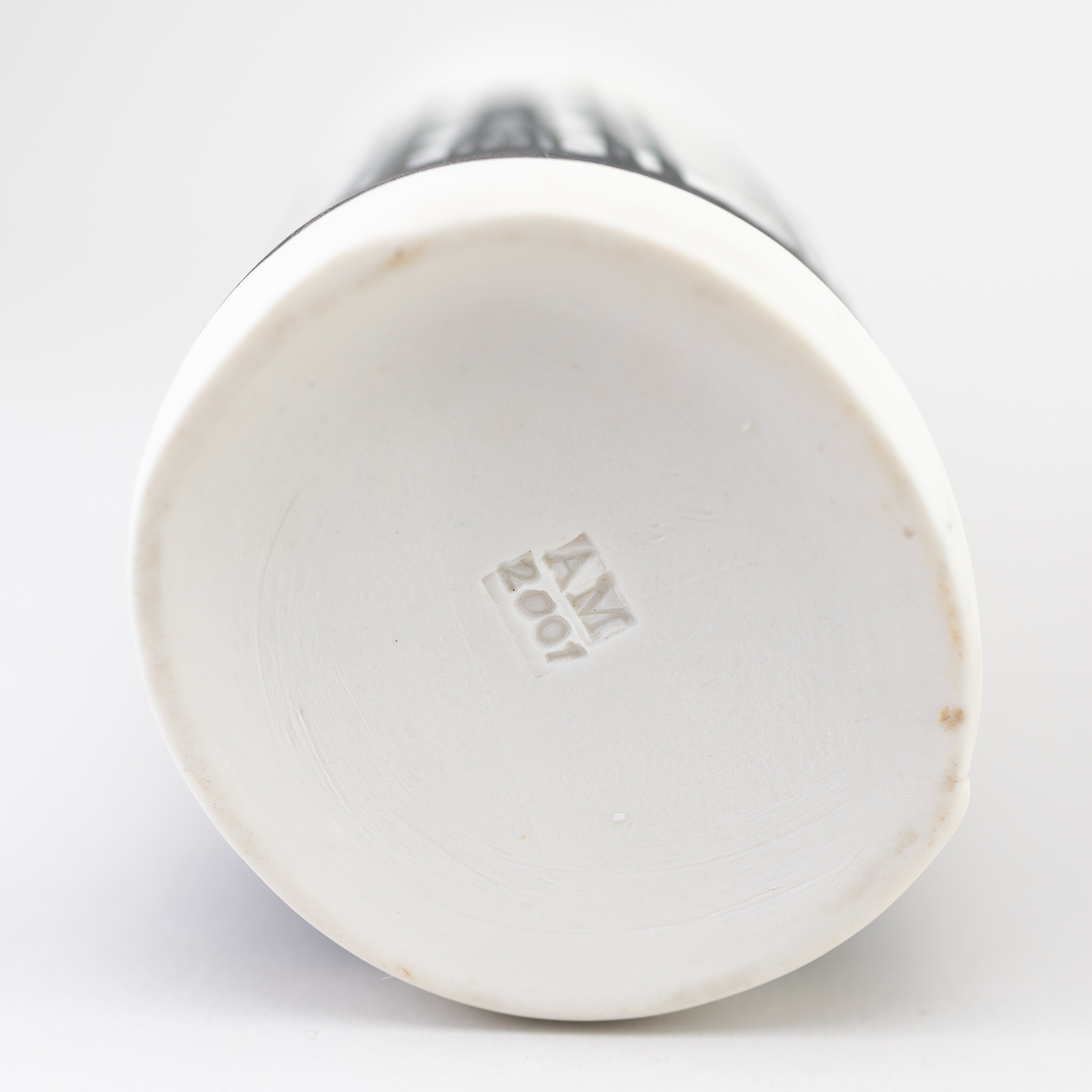 Artwork by Christian Marsden, a stoneware vase in the form of a London brick covered in mottled white glaze decorated with a printed photographic image of a gasholder, Made of mottled white glaze