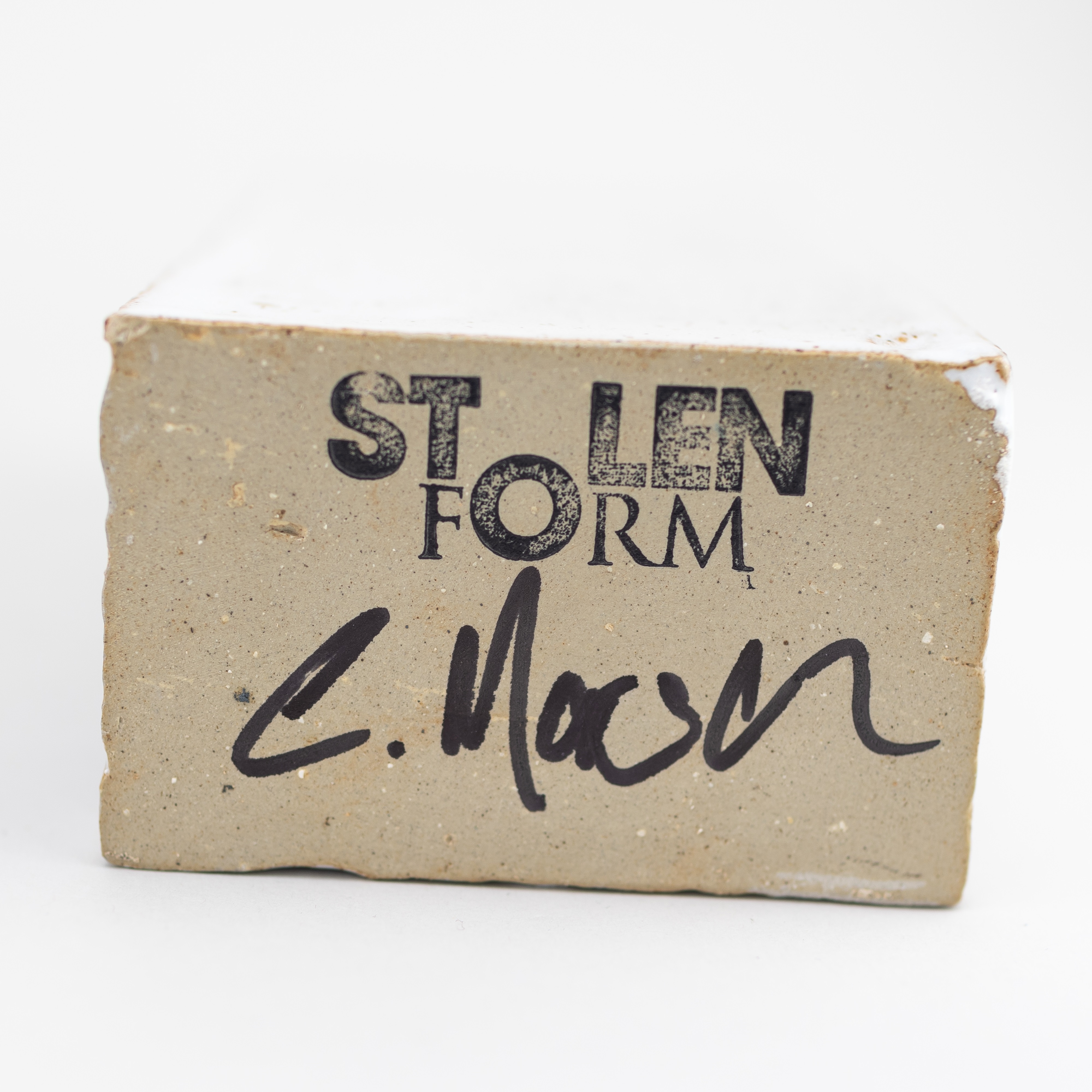 Artwork by Christian Marsden, a stoneware vase in the form of a London brick covered in mottled white glaze decorated with a printed photographic image of a gasholder, Made of mottled white glaze