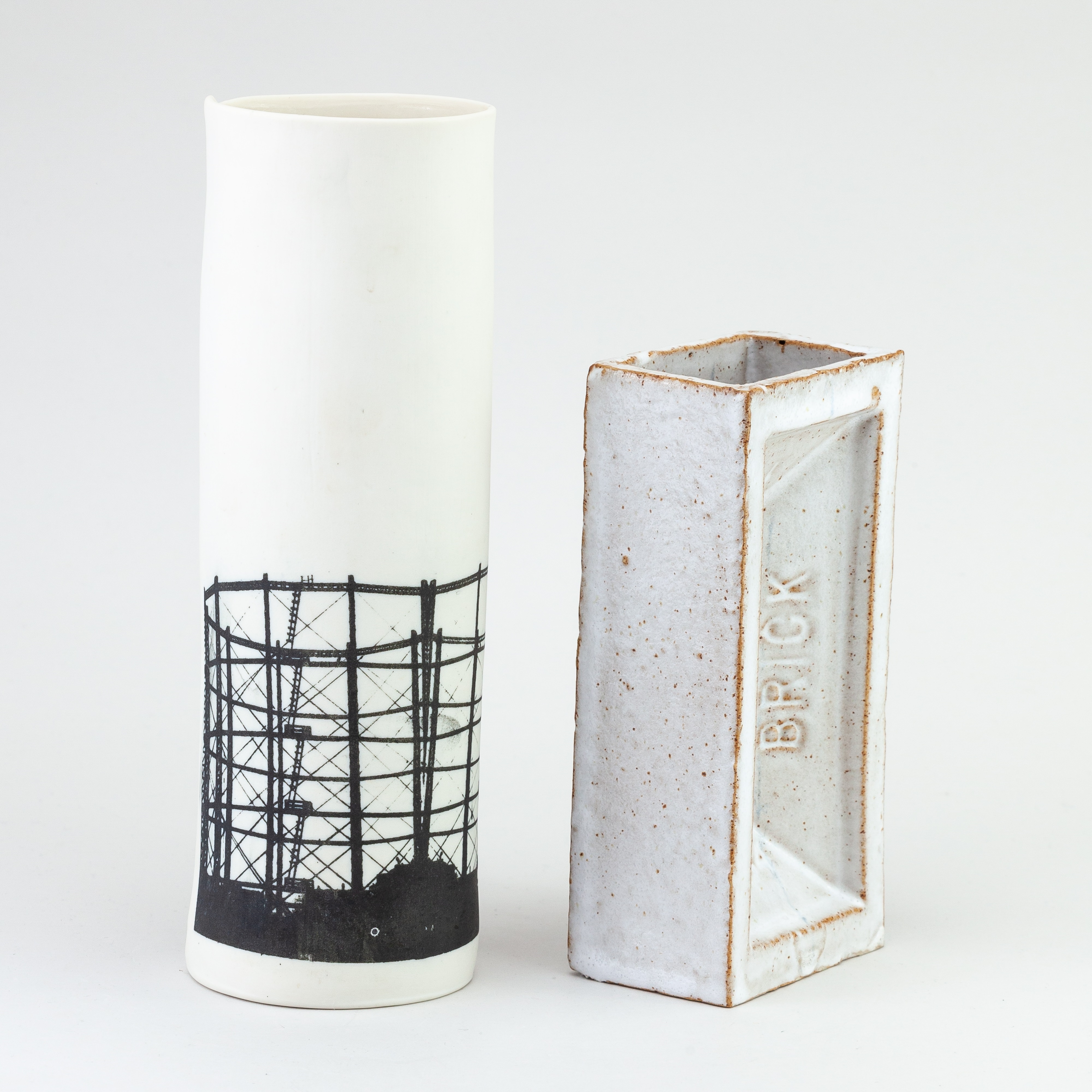 Artwork by Christian Marsden, a stoneware vase in the form of a London brick covered in mottled white glaze decorated with a printed photographic image of a gasholder, Made of mottled white glaze