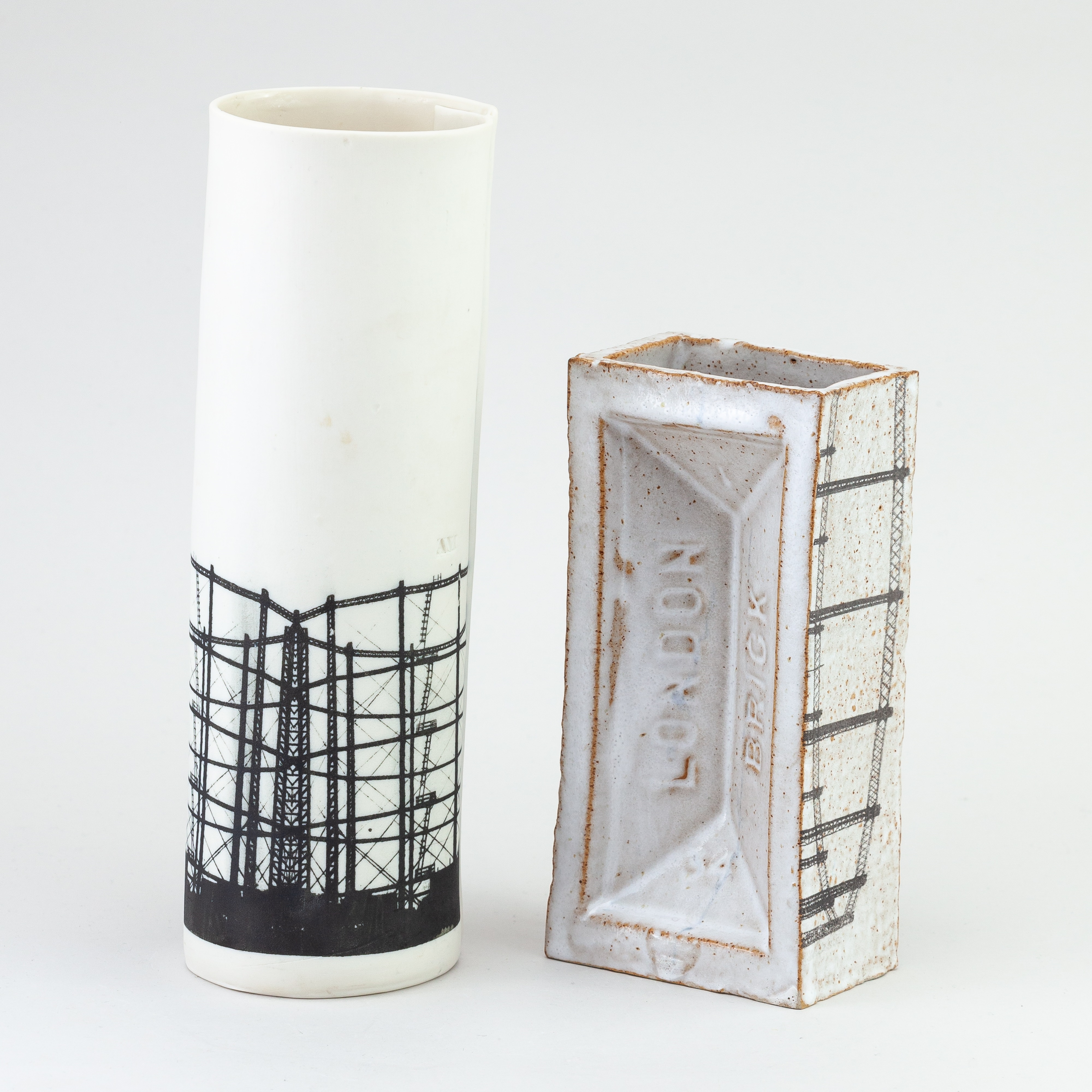 Artwork by Christian Marsden, a stoneware vase in the form of a London brick covered in mottled white glaze decorated with a printed photographic image of a gasholder, Made of mottled white glaze