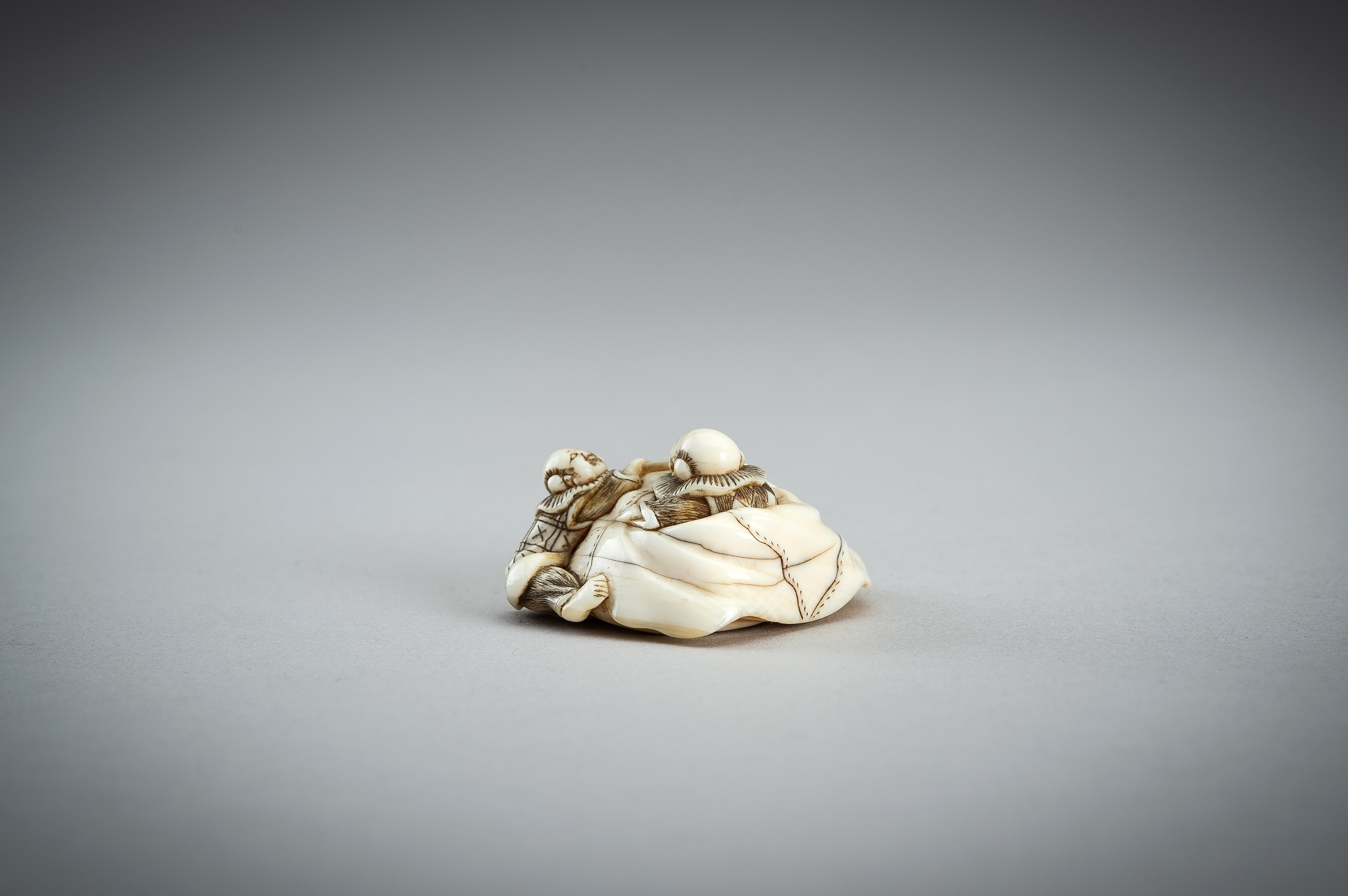 Hojitsu | HOJITSU: AN IVORY NETSUKE OF TWO KARAKO PLAYING WITH HOTEI’S ...