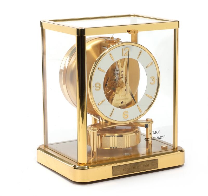 A brass and glass mantle clock, visible movement white chapter ring of white enamel, Arabic numerals - Jaeger-LeCoultre