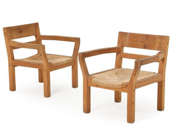 A pair of solid pine easy chairs, seats with papercord by Tage Poulsen