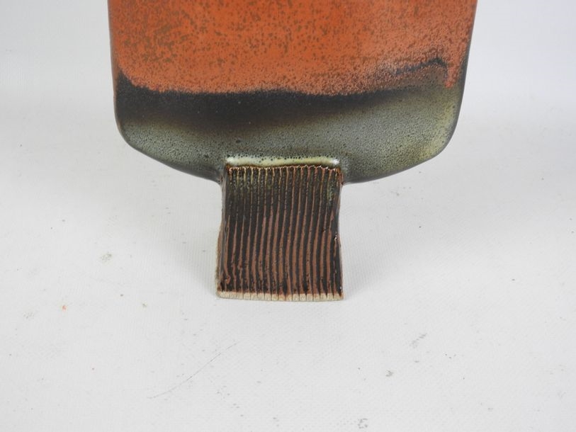 Artwork by Pierrette Soulet, Vase on pedestal with flattened body in orange glazed ceramic, Made of orange glazed ceramic