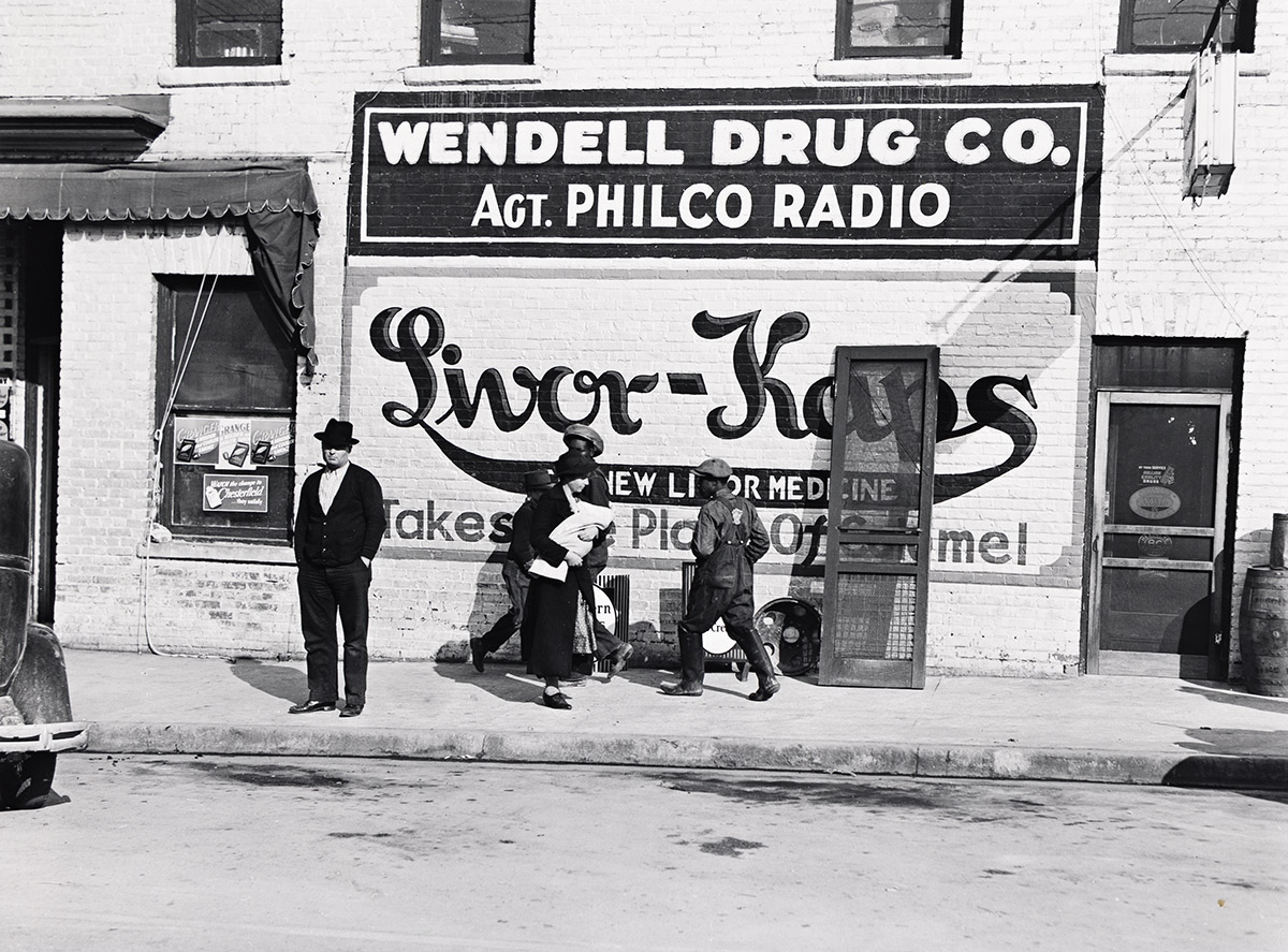 Advertisement on side of drug store, Wendell Drug Co., North Carolina. - Marion Post Wolcott