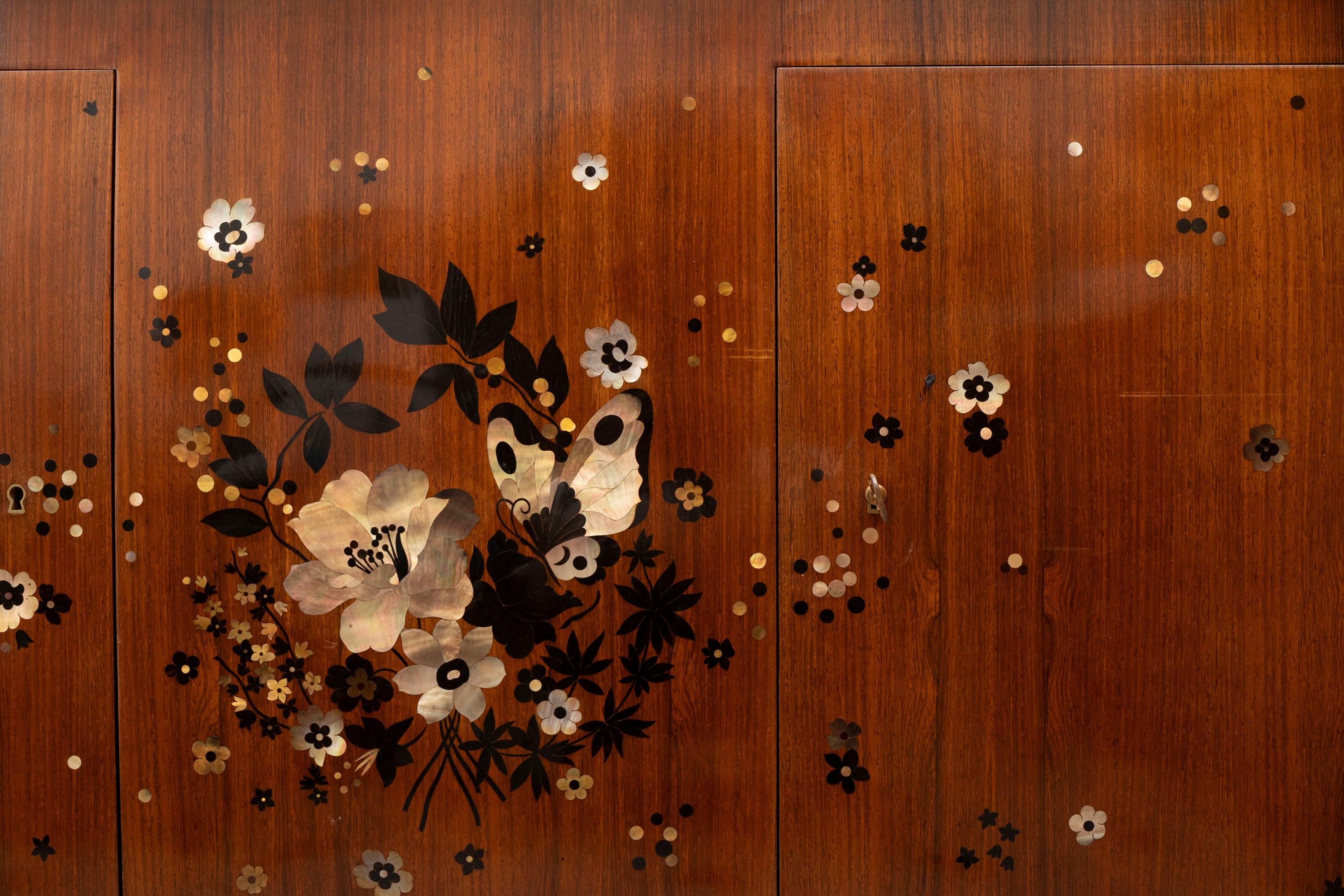 Artwork by Jules Leleu, Important and rare pair of commodes inlaid with mother of pearl and various woods, Made of gilt bronze