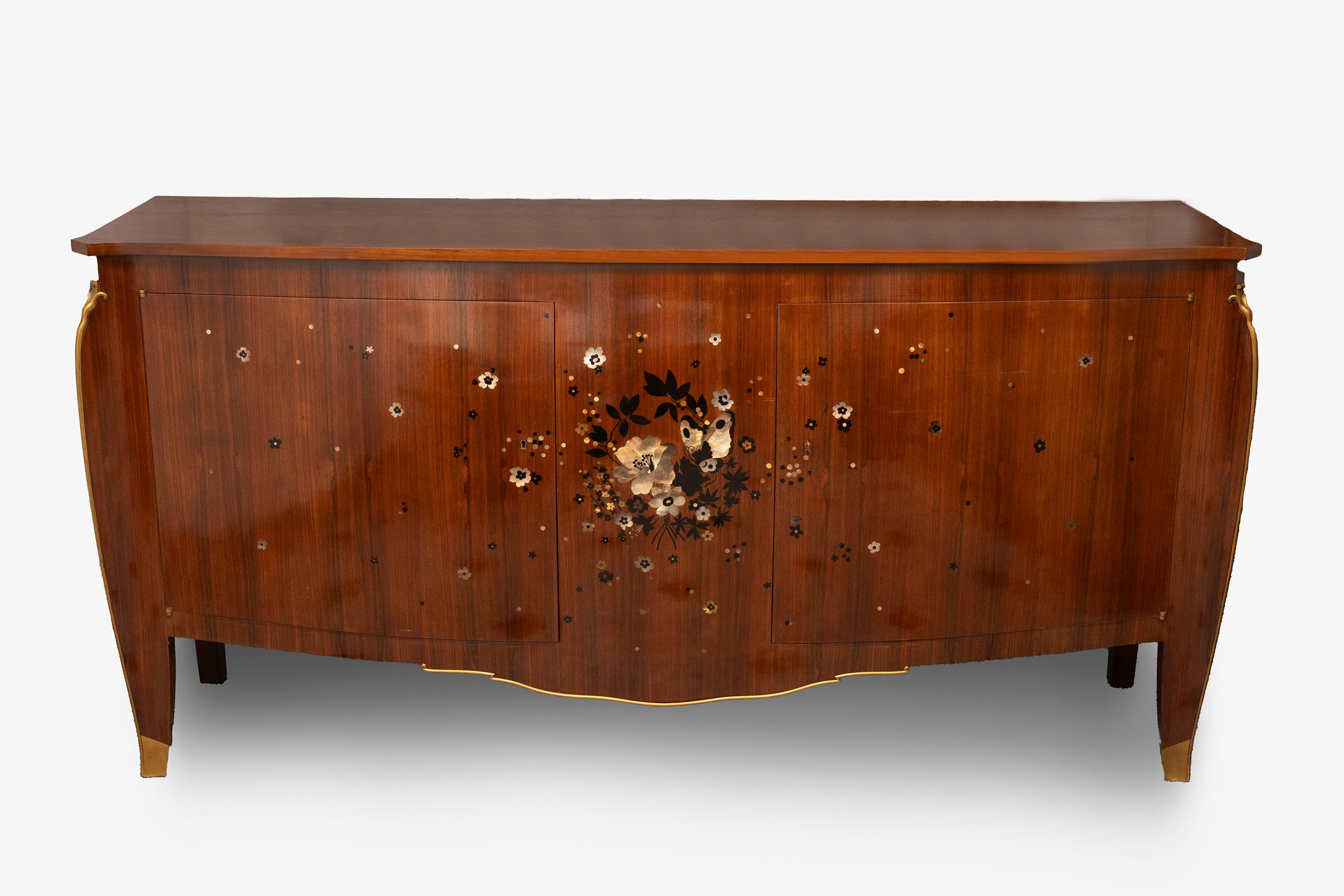 Artwork by Jules Leleu, Important and rare pair of commodes inlaid with mother of pearl and various woods, Made of gilt bronze