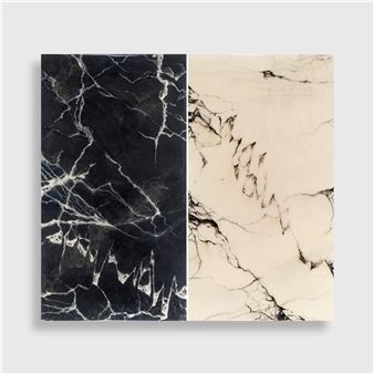 A minimalist diptych featuring contrasting black and white marble textures.