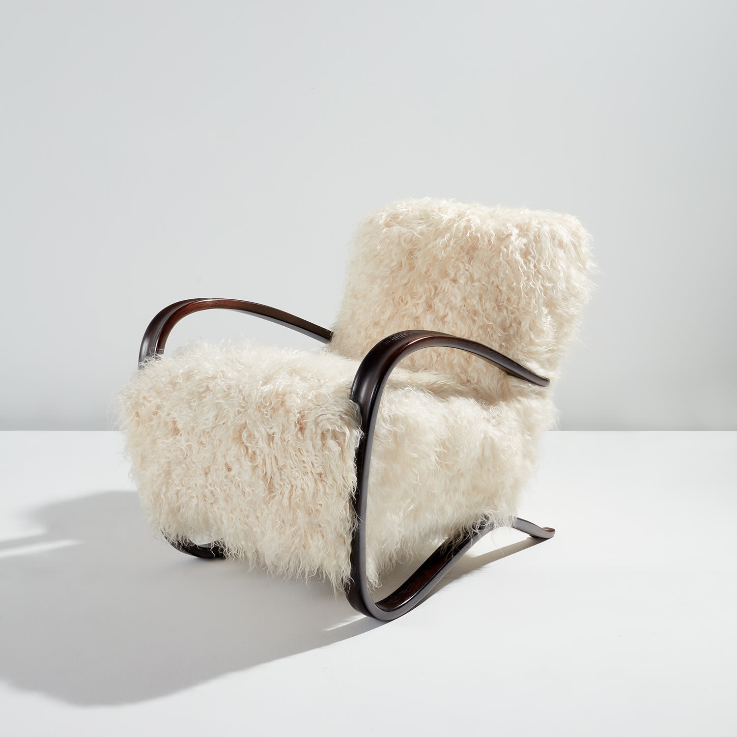 Artwork by Jindrich Halabala, Armchair, model no. H-269, Made of Stained beech, sheepskin upholstery
