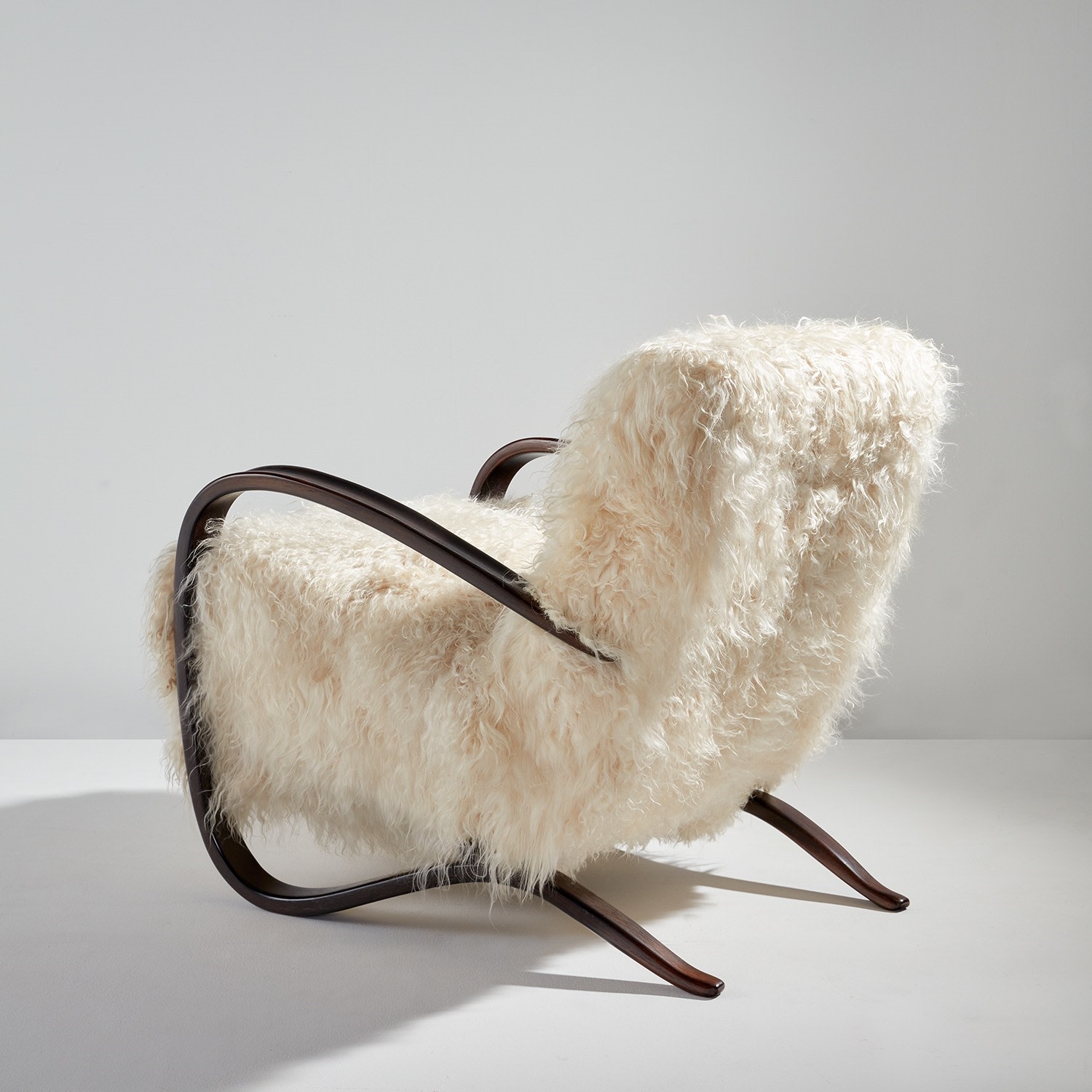 Artwork by Jindrich Halabala, Armchair, model no. H-269, Made of Stained beech, sheepskin upholstery