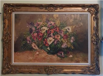 flowers in a vase on a table setting. - Leslie Furlong