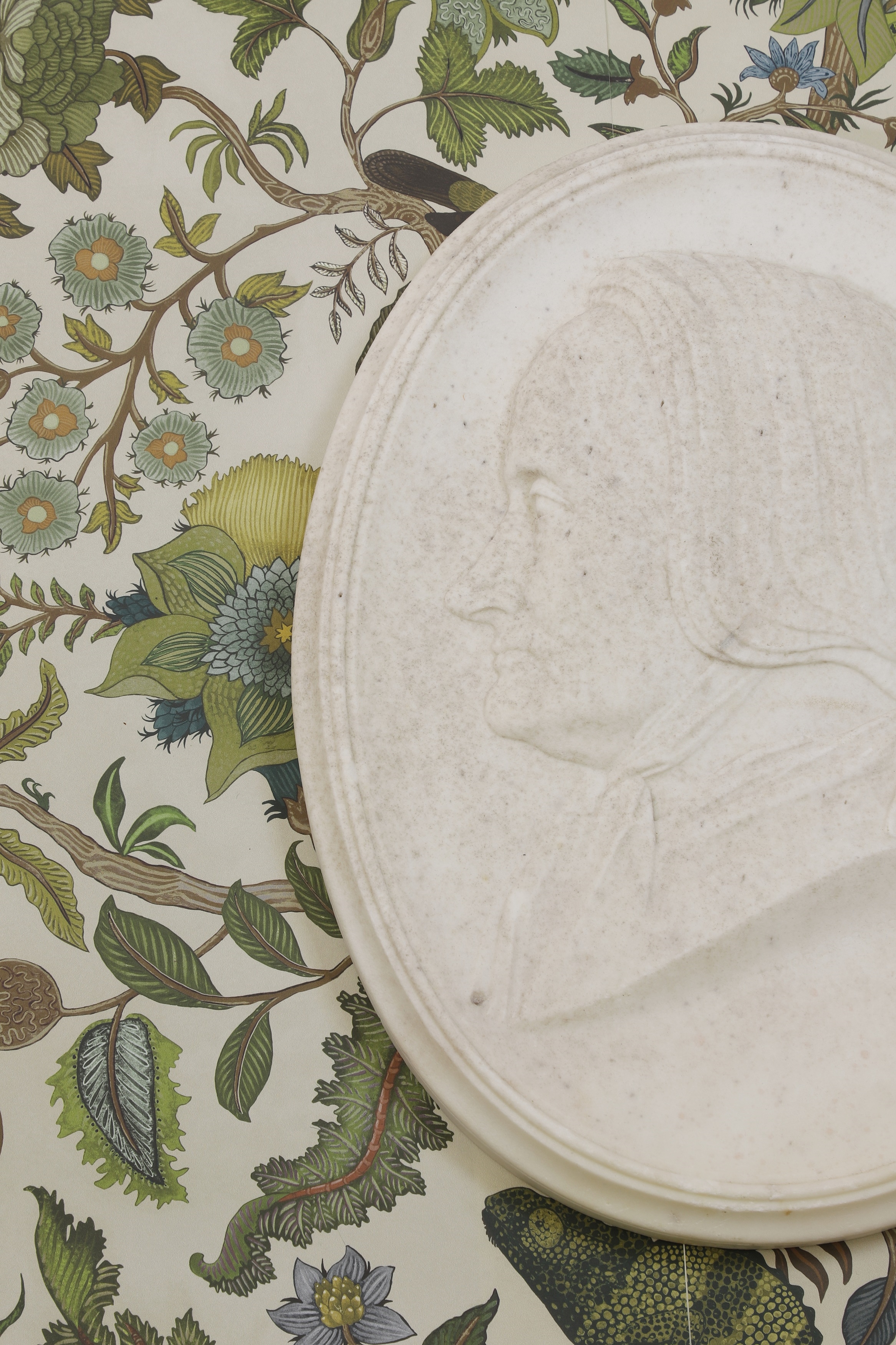 Thomas Woolner | a carved white marble portrait medallion of a woman in ...