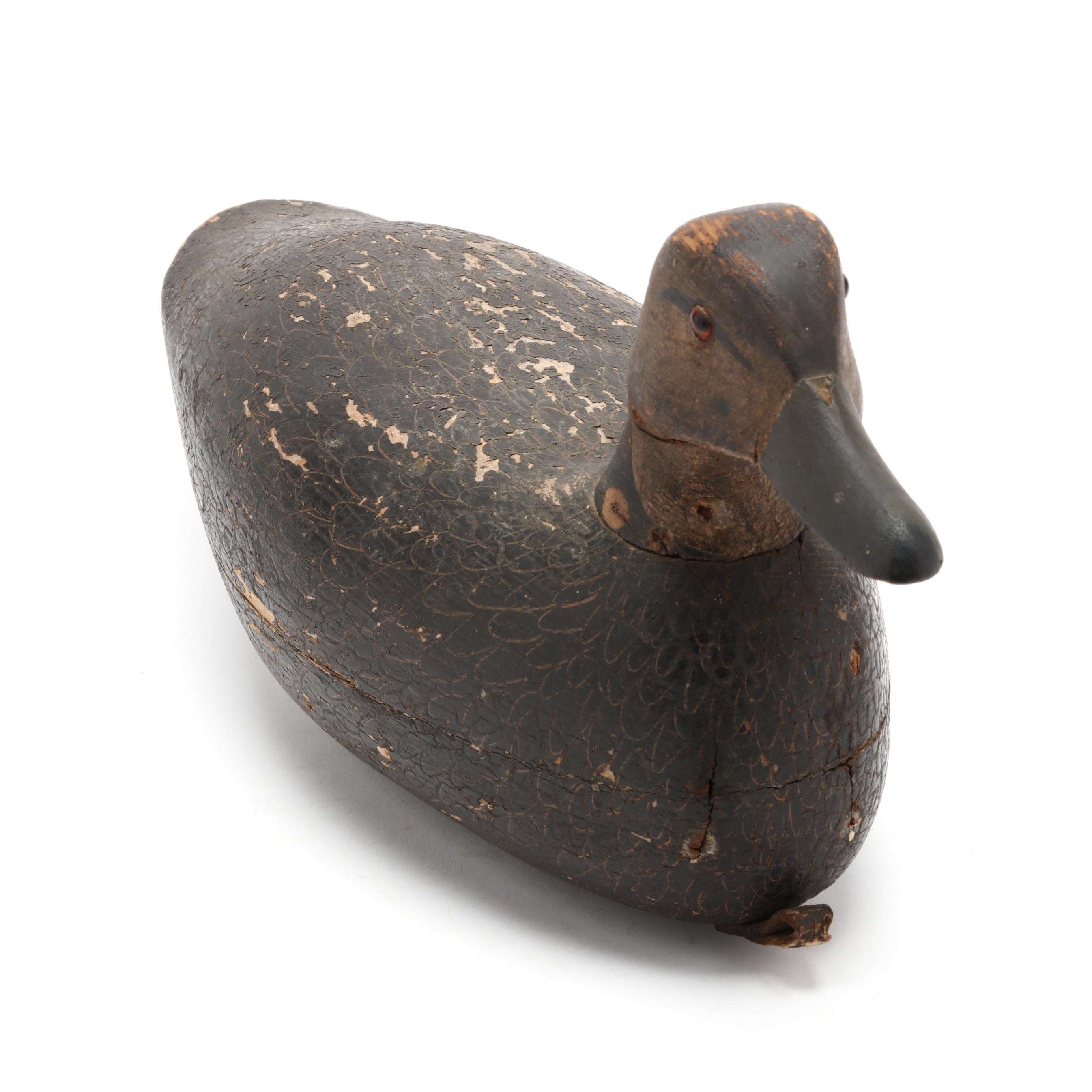 Artwork by Samuel Soper, Black Duck, Made of carved and painted wood, glass