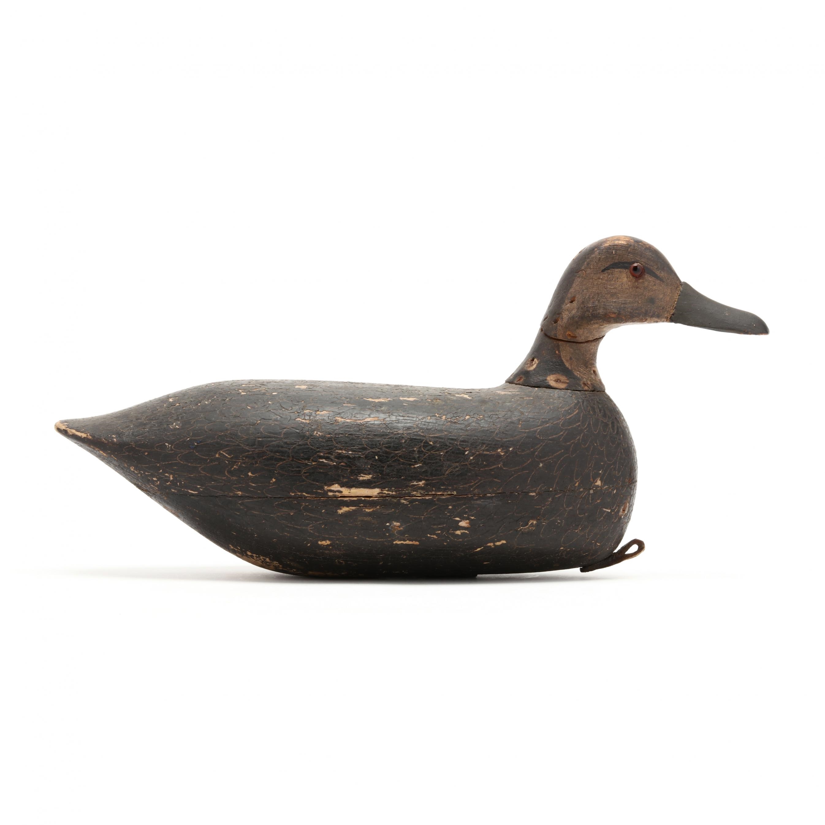 Artwork by Samuel Soper, Black Duck, Made of carved and painted wood, glass