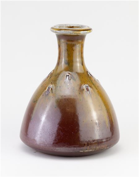 JOHN JELFS (born 1946); a stoneware bottle covered in kaki and ochre glaze with impressed decoration by John Jelfs