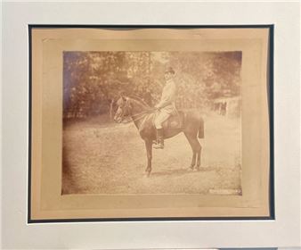 R. MAYER Man on horseback, Escolta, Philippines 1885. Photograph. Albumen print mounted on card, signed, dated and located in the negative. Image: 17.5 x 22 cm; mount: 26.5 x 34.5 cm - R. Mayer