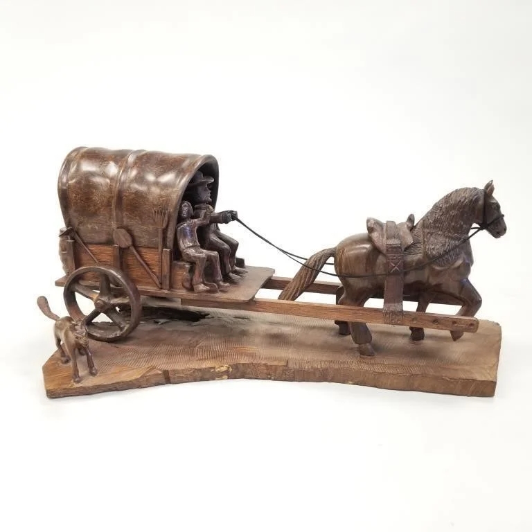 Artwork by Roberto Solorio, Wagon & figures, Made of carved iron wood