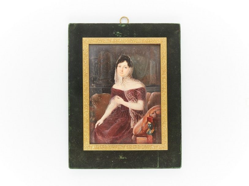 Artwork by Amélie Le Duc, Large rectangular miniature signed lower right "Amélie / Le Duc / Delisa (?)" depicting a young woman seated on a neo-Egyptian empire sofa, wearing a burgundy dress and lace veil, Made of green velvet and gilt bronze