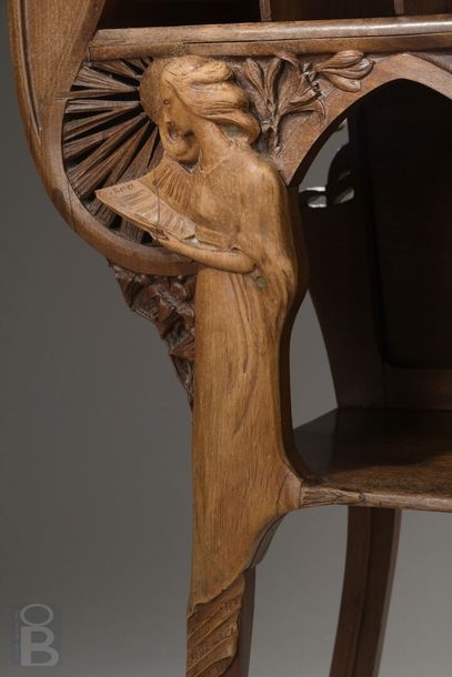 Artwork by René Defland, Score cabinet in  of two young women, Made of carved and molded cherry wood with orange wood decoration